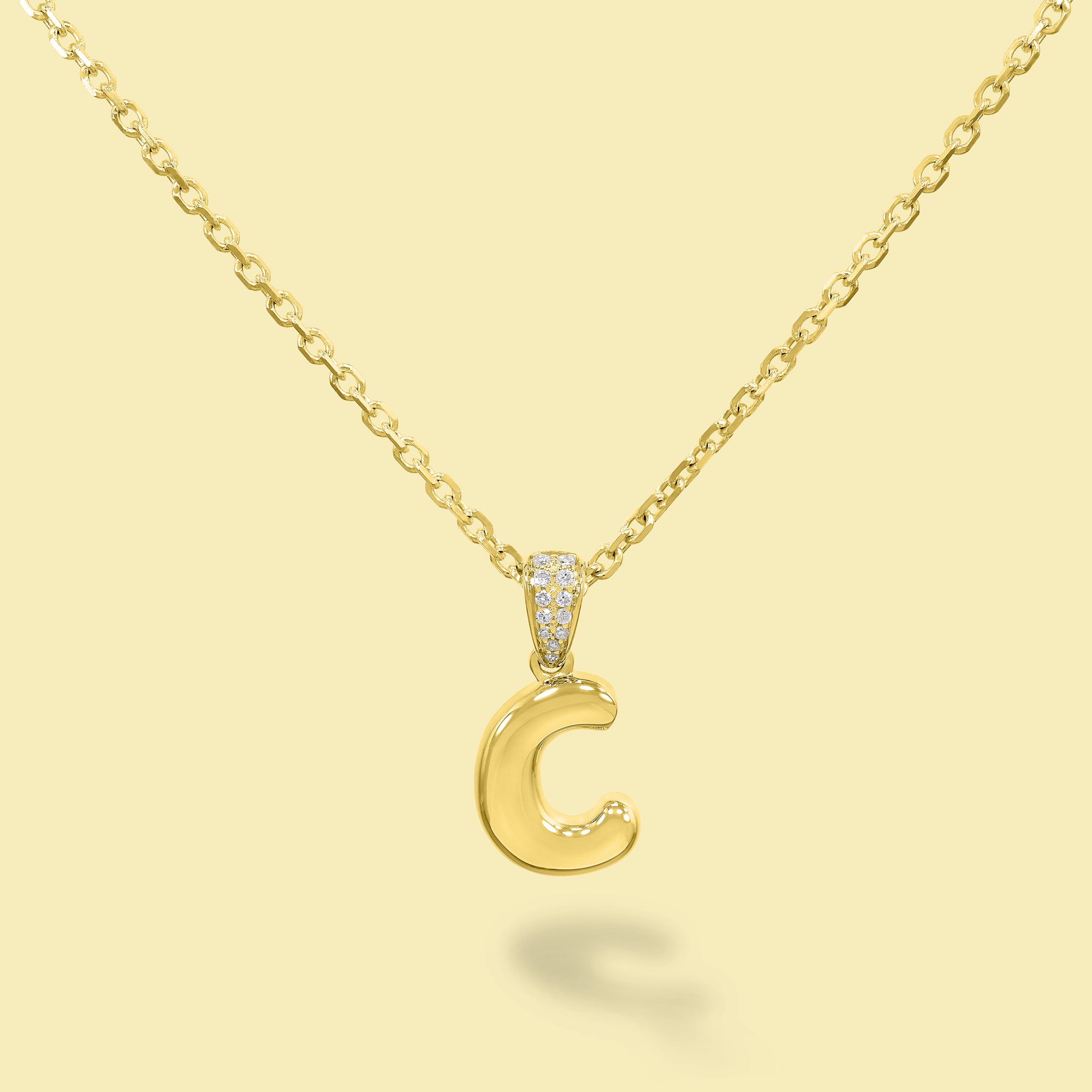 The Cloud, Gold Initial Diamond Puff Pendant Necklace handcrafted in 14K Gold by Earthena Jewelry of Beverly Hills, California.