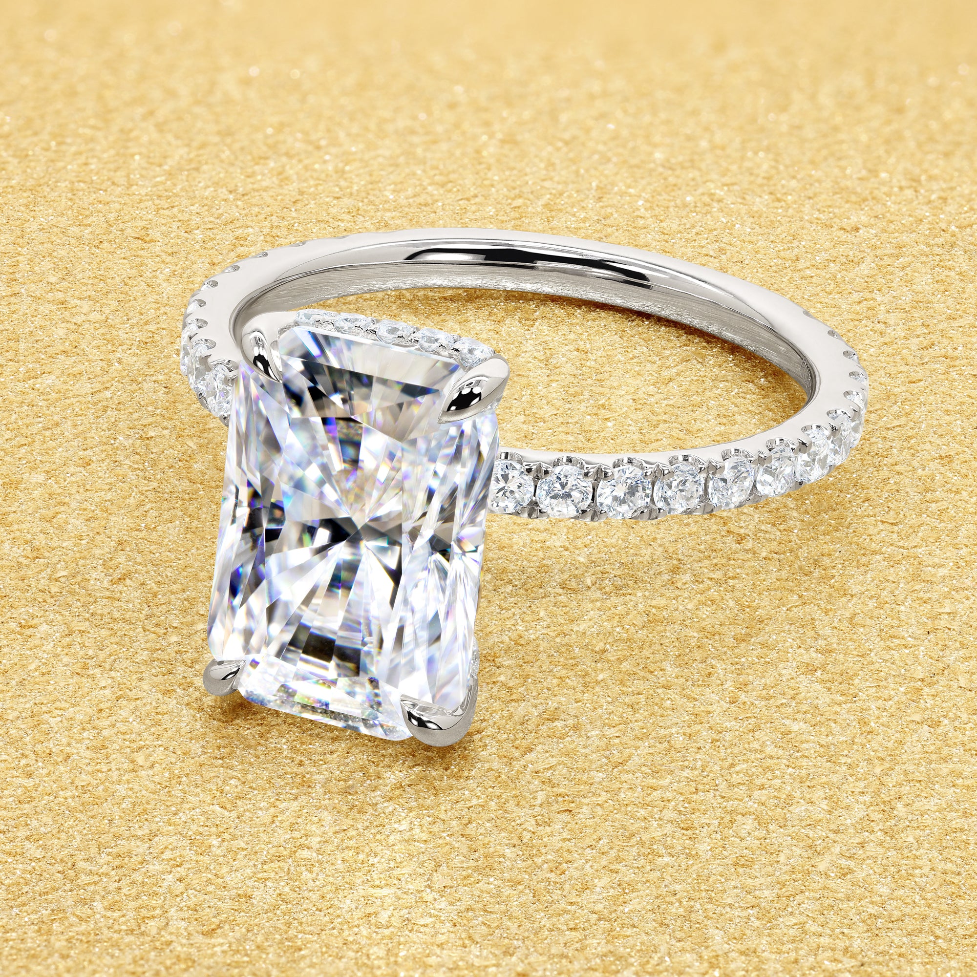 Classic Selina 3ct Elongated Radiant-cut Moissanite Hidden Vow Halo Lab-grown Diamond Engagement ring in 14K gold, 18K gold, or Platinum by Earthena Jewelry of Beverly Hills.