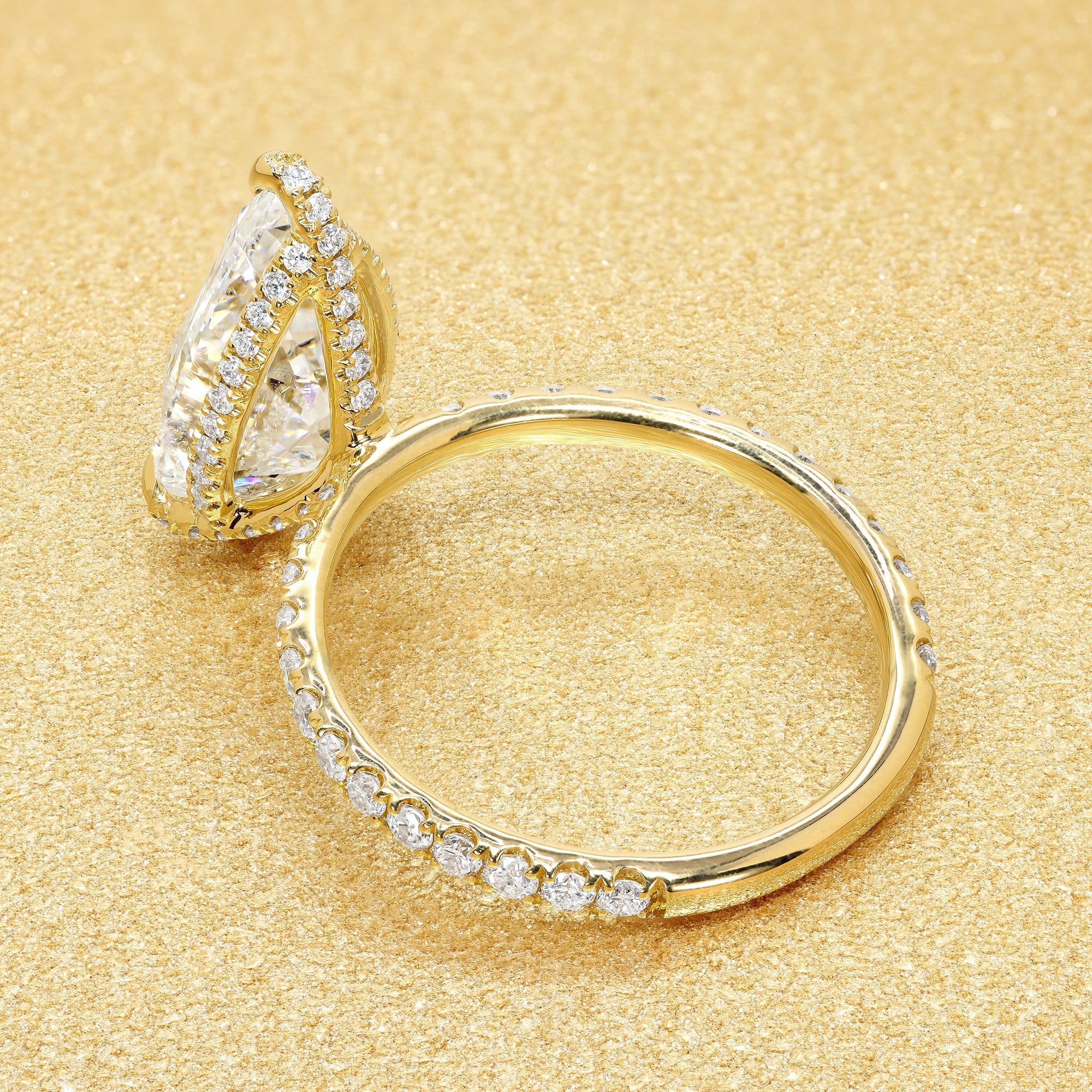 Classic Selina 3.3ct Elongated Pear-cut Lab-grown Diamond Hidden Wrap Halo Engagement ring in 18K Yellow Gold by Earthena Jewelry of Beverly Hills.