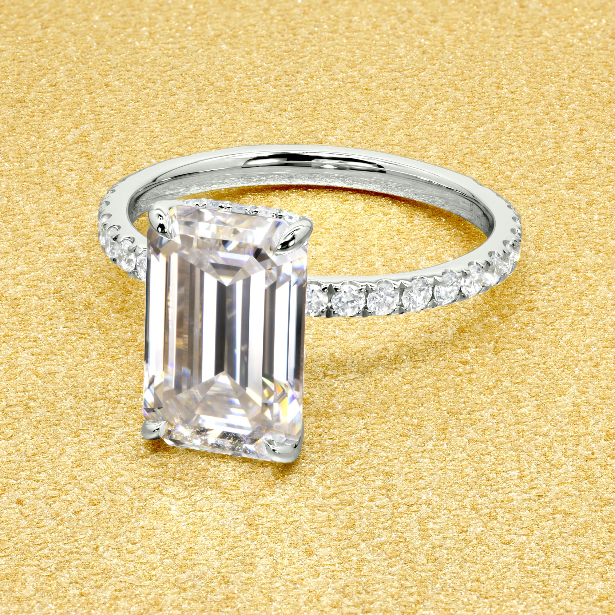 Selina 3.5ct Elongated Emerald-Cut Moissanite Hidden Vow Halo Engagement Ring crafted in 14K gold, 18K gold, or Platinum by Earthena Jewelry of Beverly Hills.