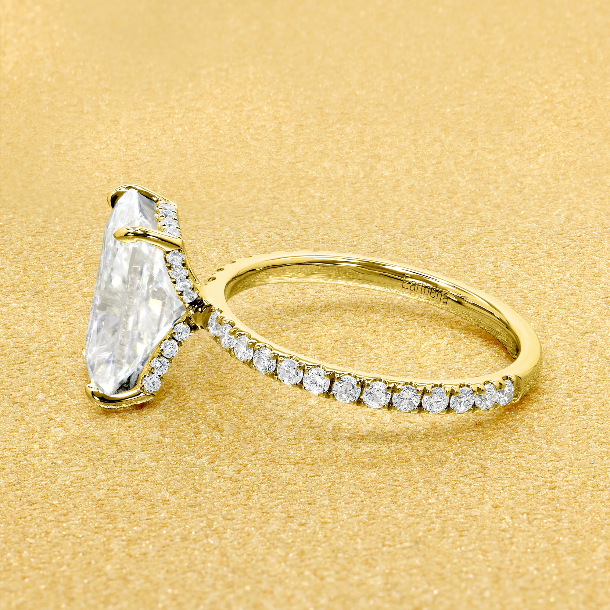 Selina 3.5ct Elongated Emerald-Cut Moissanite Hidden Vow Halo Engagement Ring crafted in 14K gold, 18K gold, or Platinum by Earthena Jewelry of Beverly Hills.