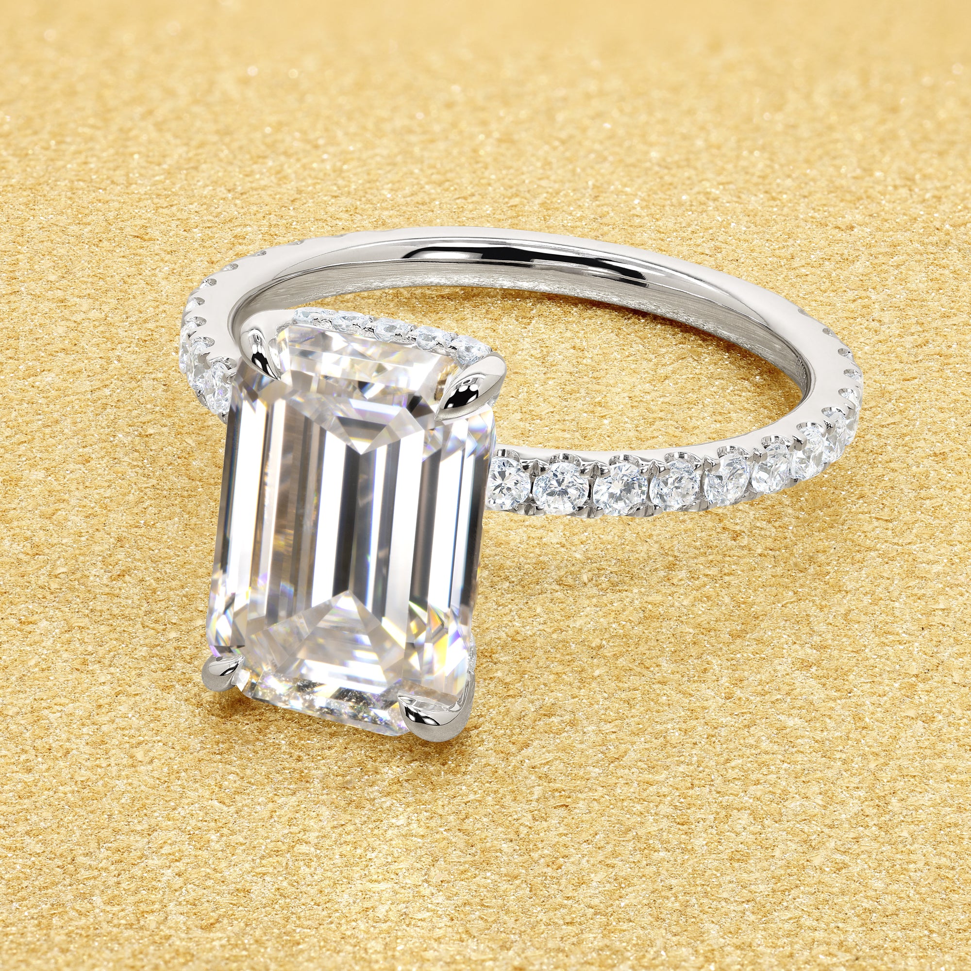 Classic Selina 3ct Elongated Emerald-cut Moissanite Hidden Vow Halo Lab-grown Diamond Engagement ring in 14K gold, 18K gold, or Platinum by Earthena Jewelry of Beverly Hills.