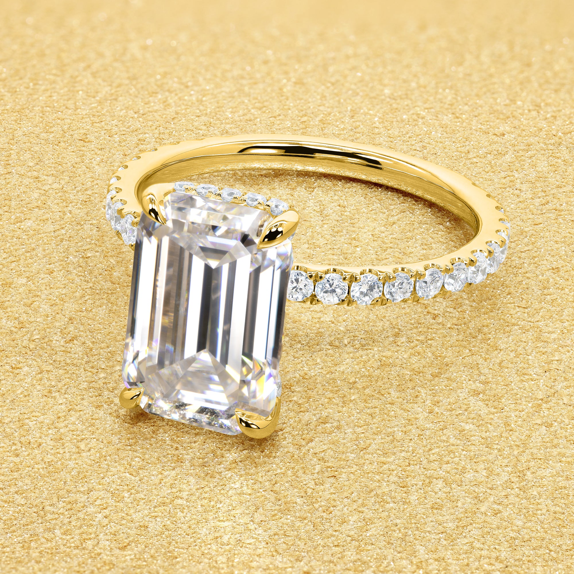 Classic Selina 3ct Elongated Emerald-cut Moissanite Hidden Vow Halo Lab-grown Diamond Engagement ring in 14K gold, 18K gold, or Platinum by Earthena Jewelry of Beverly Hills.