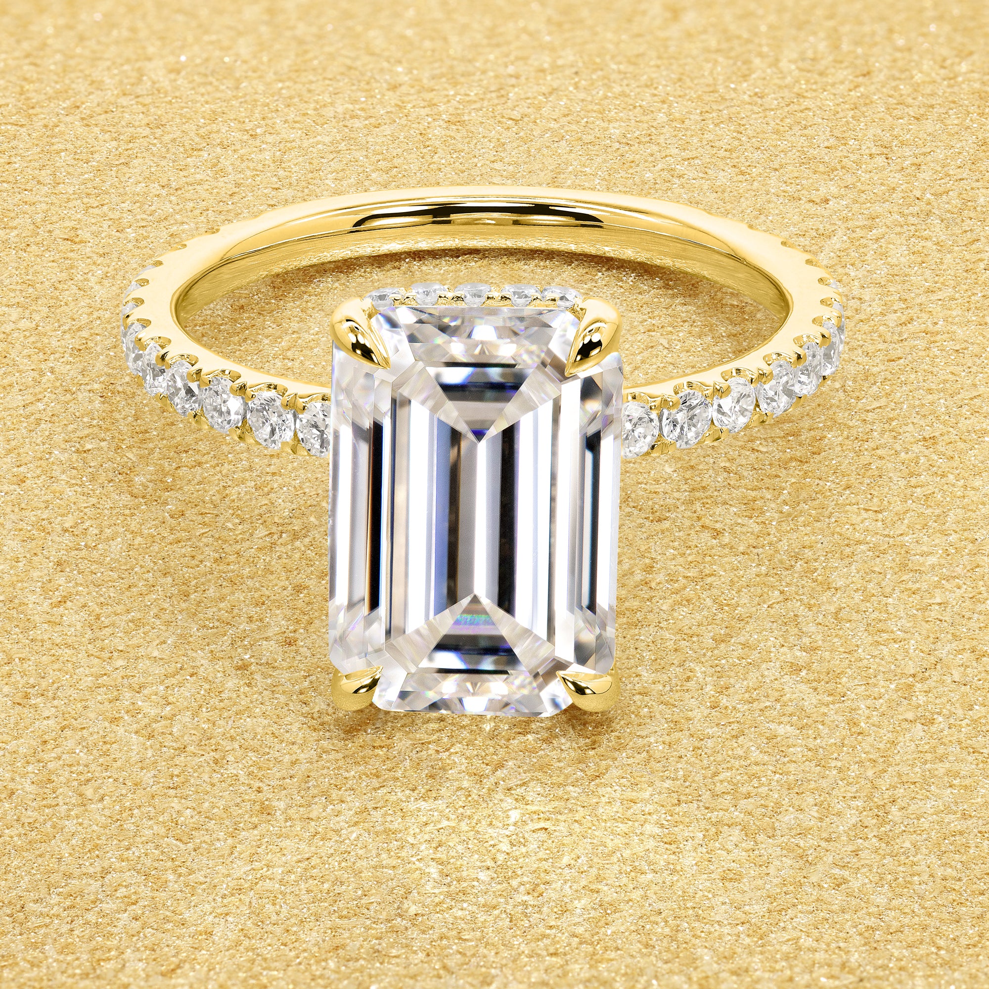 Classic Selina 3ct Elongated Emerald-cut Moissanite Hidden Vow Halo Lab-grown Diamond Engagement ring in 14K gold, 18K gold, or Platinum by Earthena Jewelry of Beverly Hills.