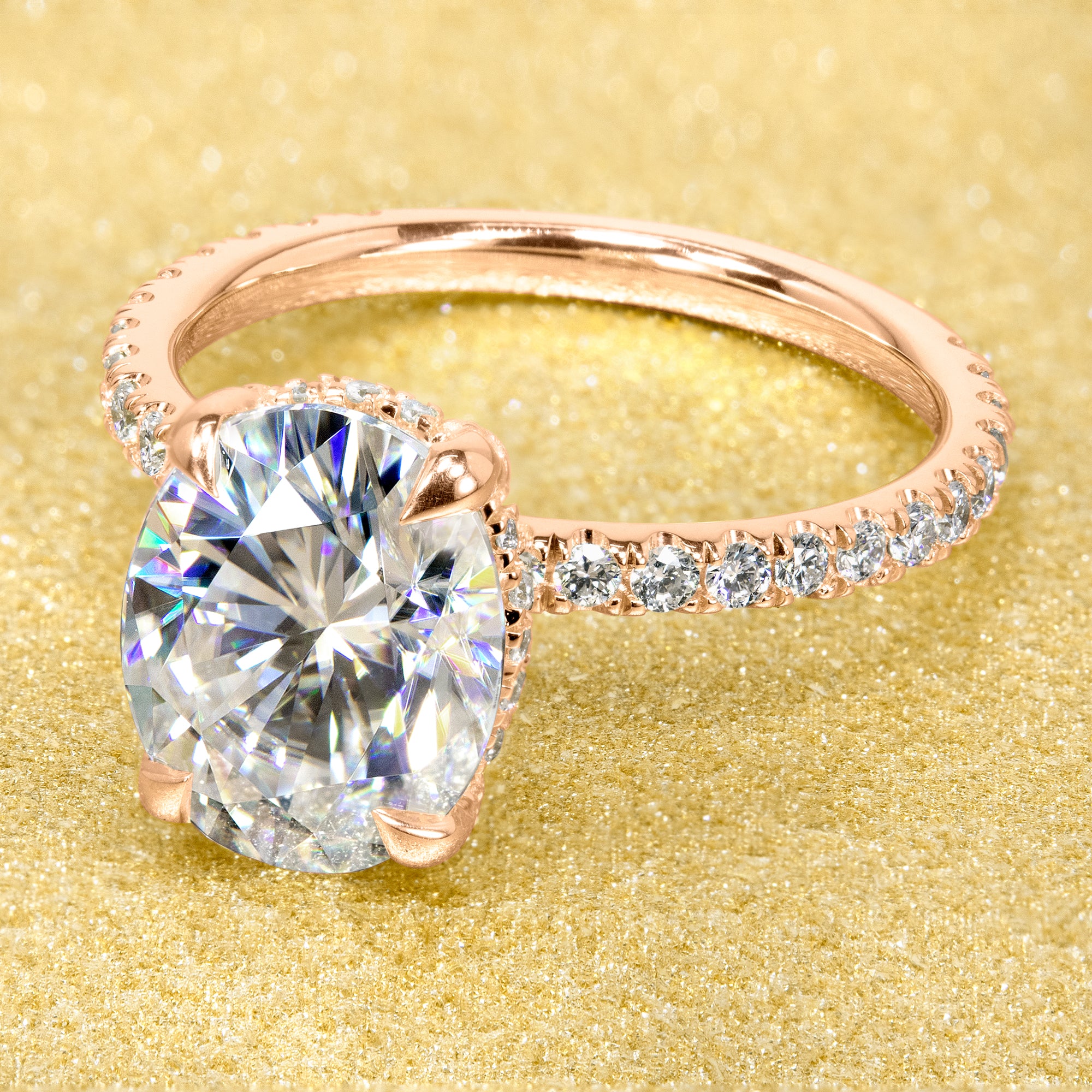 Classic and elegant 3-carats Oval-cut Moissanite and Lab Diamond Hidden Wrap Halo engagement ring handcrafted in 14K gold, 18K gold, or Platinum handcrafted in Los Angeles by Earthena Jewelry.
