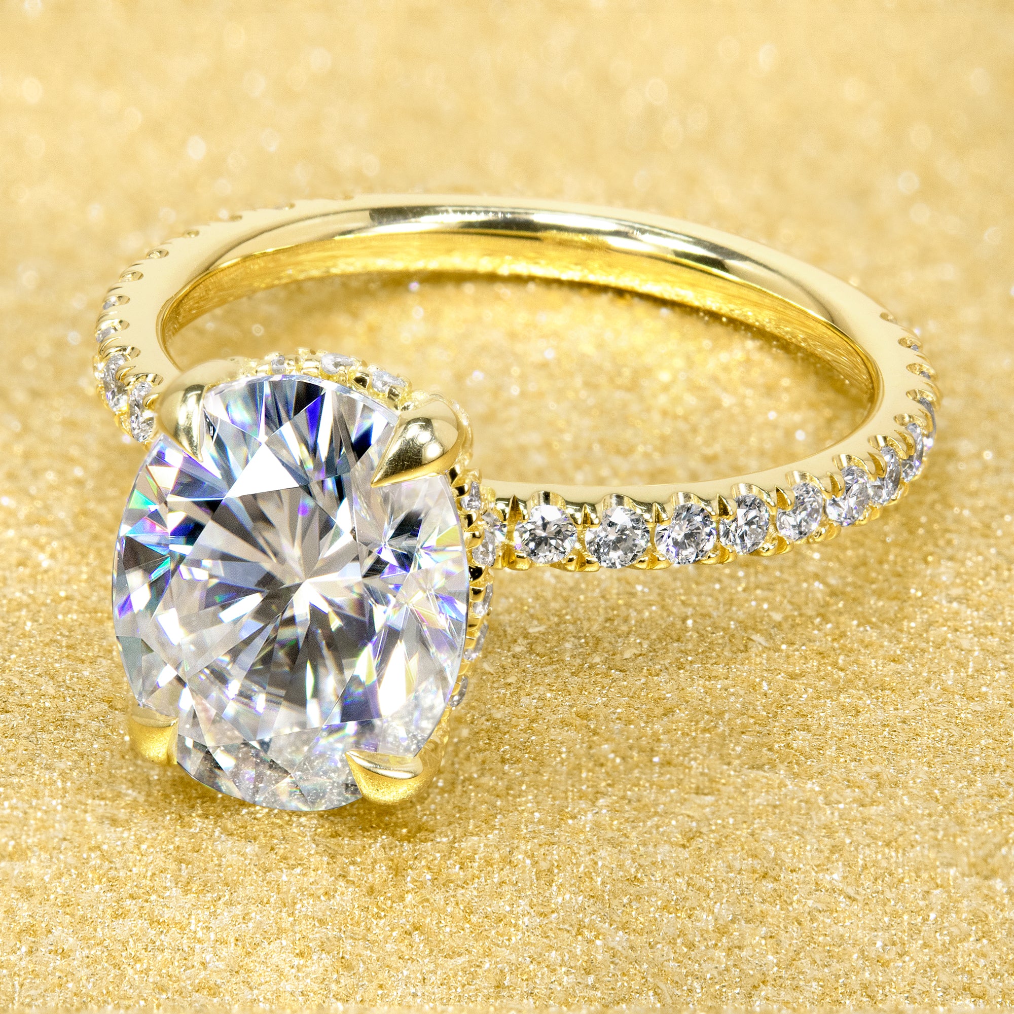 Classic and elegant 3-carats Oval-cut Moissanite and Lab Diamond Hidden Wrap Halo engagement ring handcrafted in 14K gold, 18K gold, or Platinum handcrafted in Los Angeles by Earthena Jewelry.