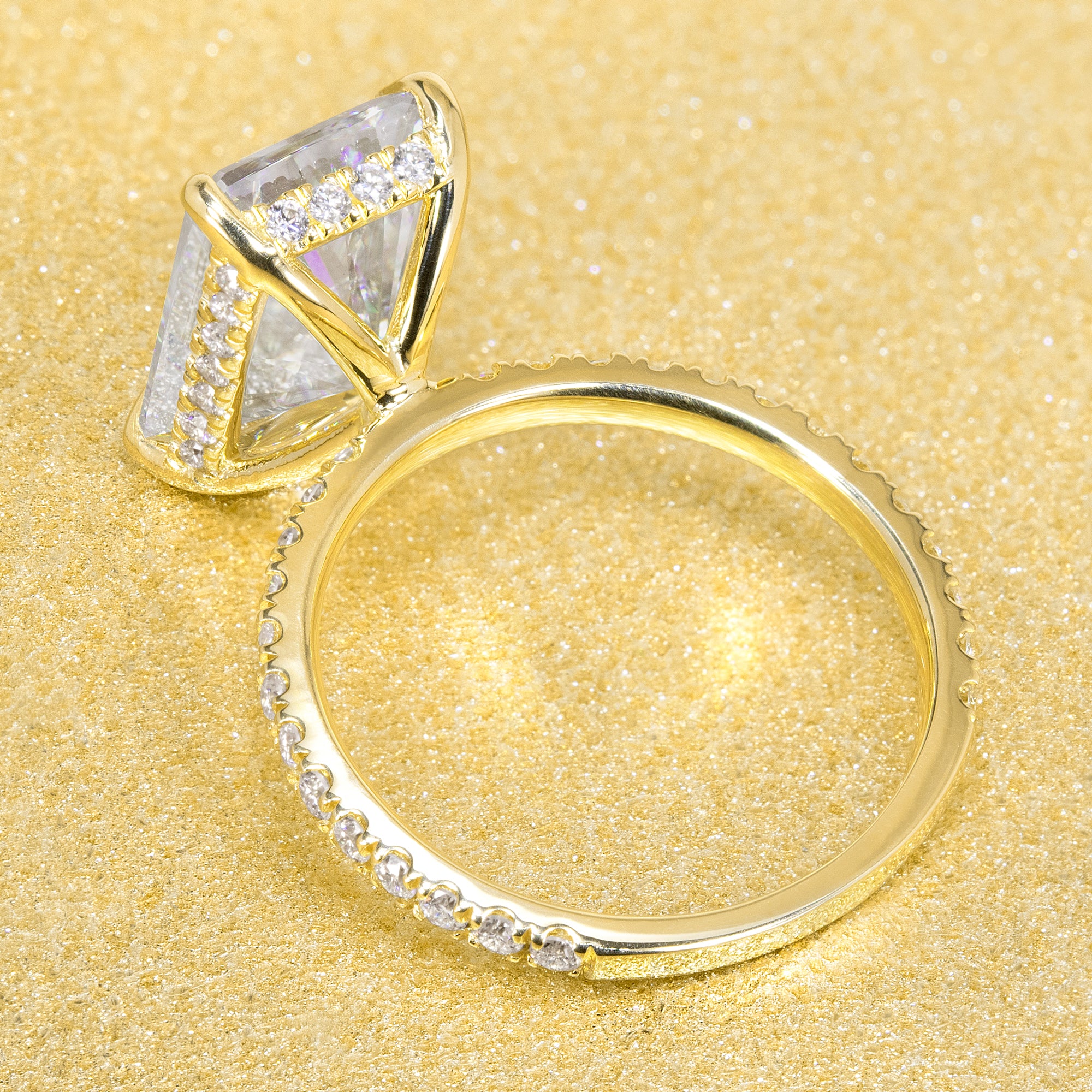 Classic Selina 5ct Elongated Emerald-Cut Lab-Grown Diamond Hidden Halo Engagement Ring in 14K Gold, 18K Gold, or Platinum by Earthena Jewelry of Beverly Hills.