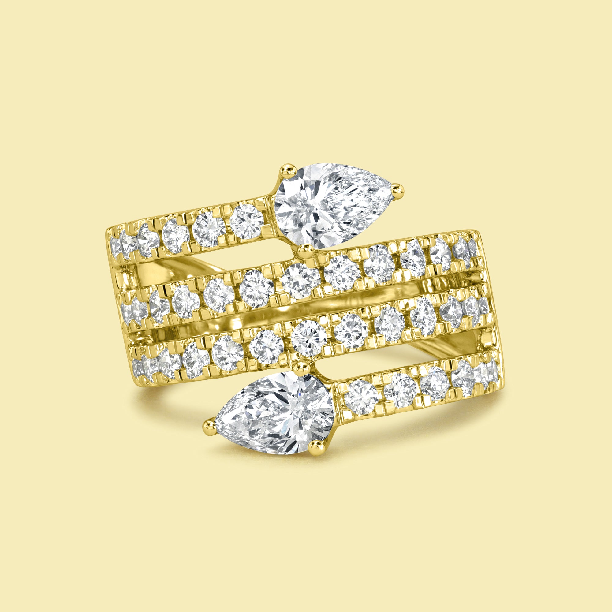 The Siya, Multi Row Bypass Diamond Band is handcrafted in 14K gold, 18K gold, or Platinum by Earthena Jewelry in Los Angeles