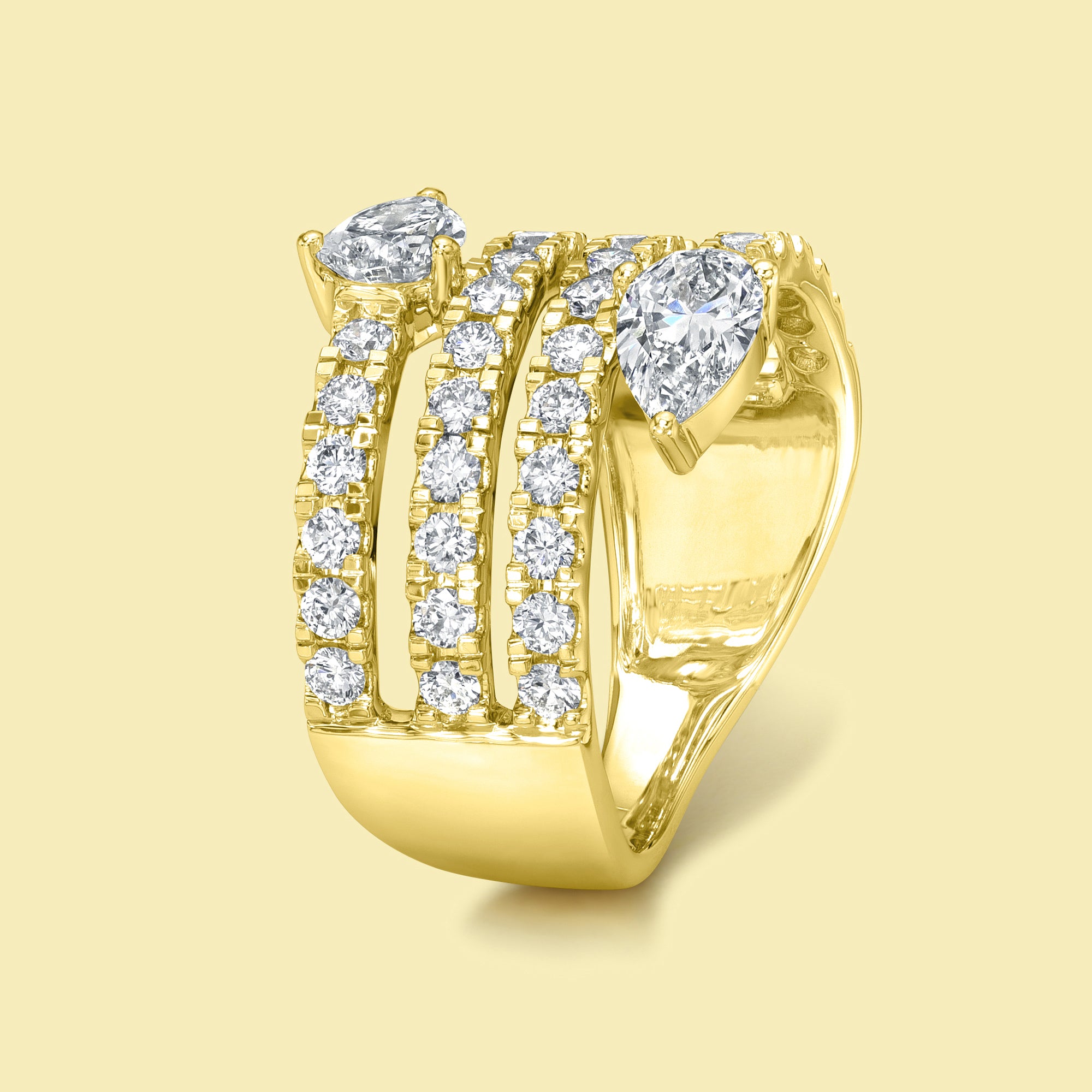 The Siya, Multi Row Bypass Diamond Band is handcrafted in 14K gold, 18K gold, or Platinum by Earthena Jewelry in Los Angeles