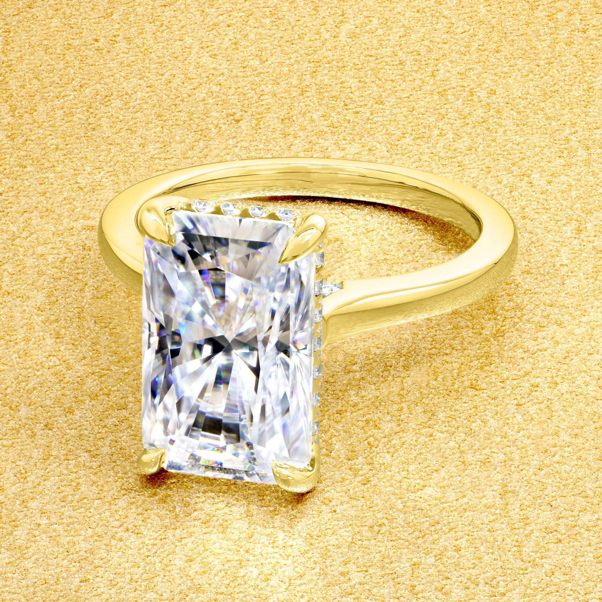 Classic Sofia 5ct Elongated Radiant-Cut Moissanite Cathedral Hidden Halo Diamond Bridge Solitaire Engagement Ring in 14K Gold, 18K Gold, or Platinum by Earthena Jewelry of Beverly Hills.