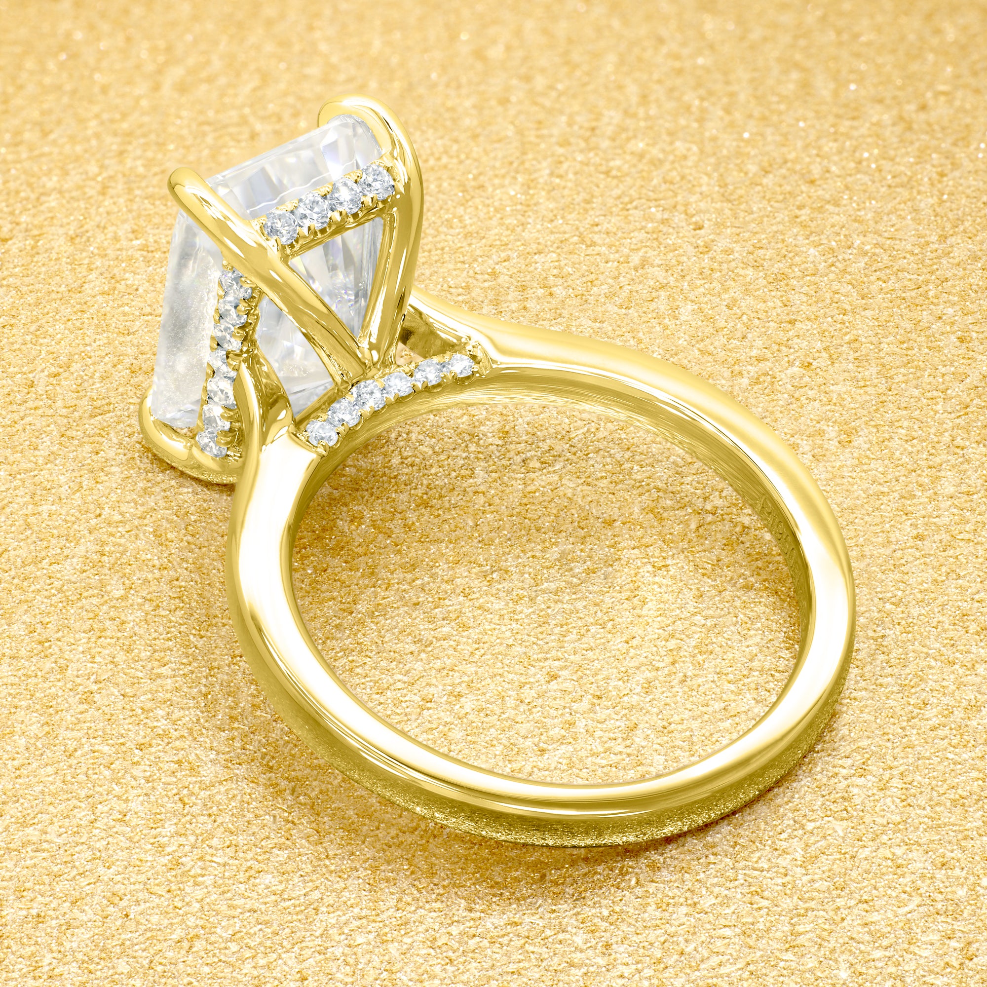 Classic Sofia 5ct Elongated Radiant-Cut Moissanite Cathedral Hidden Halo Diamond Bridge Solitaire Engagement Ring in 14K Gold, 18K Gold, or Platinum by Earthena Jewelry of Beverly Hills.