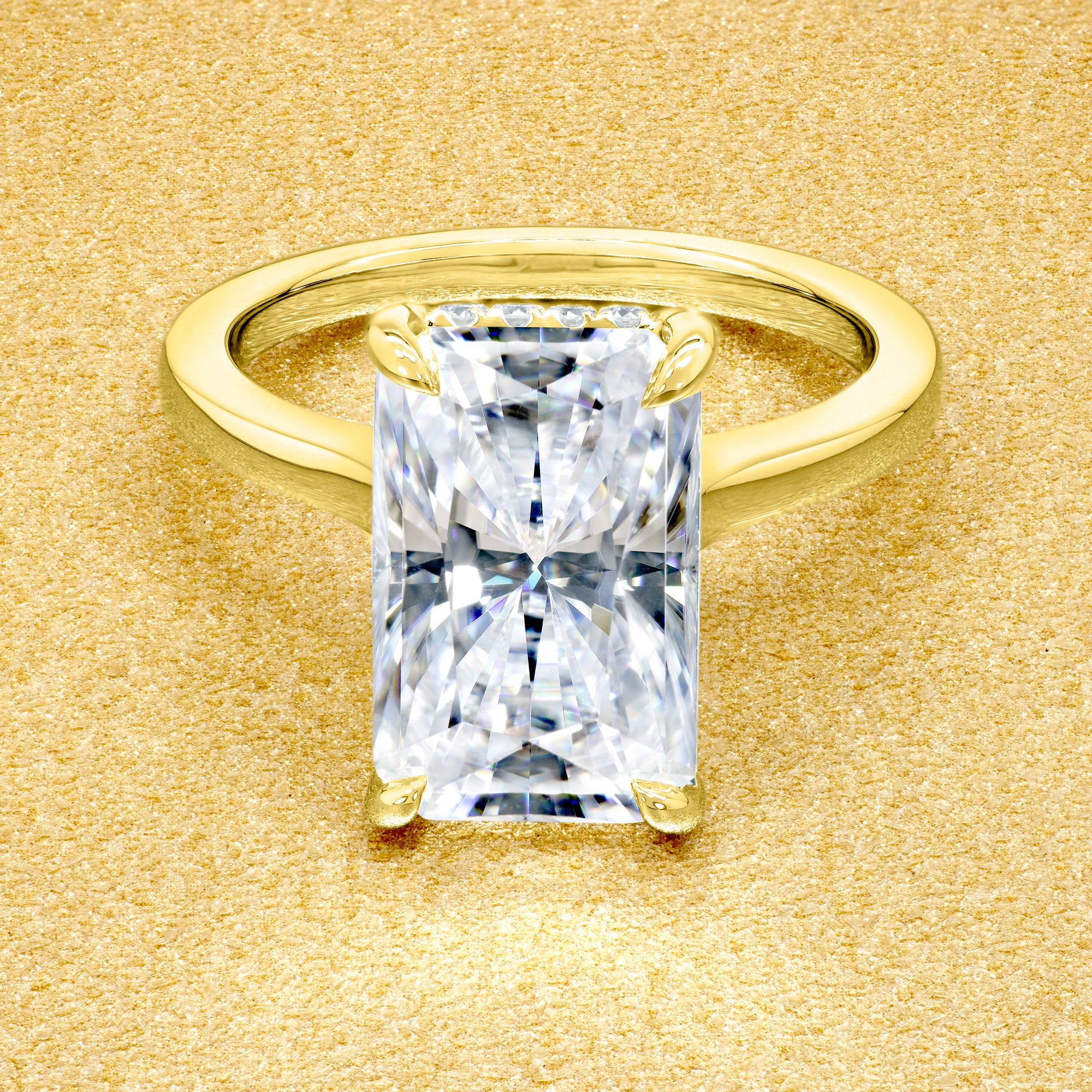 Classic Sofia 5ct Elongated Radiant-Cut Moissanite Cathedral Hidden Halo Diamond Bridge Solitaire Engagement Ring in 14K Gold, 18K Gold, or Platinum by Earthena Jewelry of Beverly Hills.