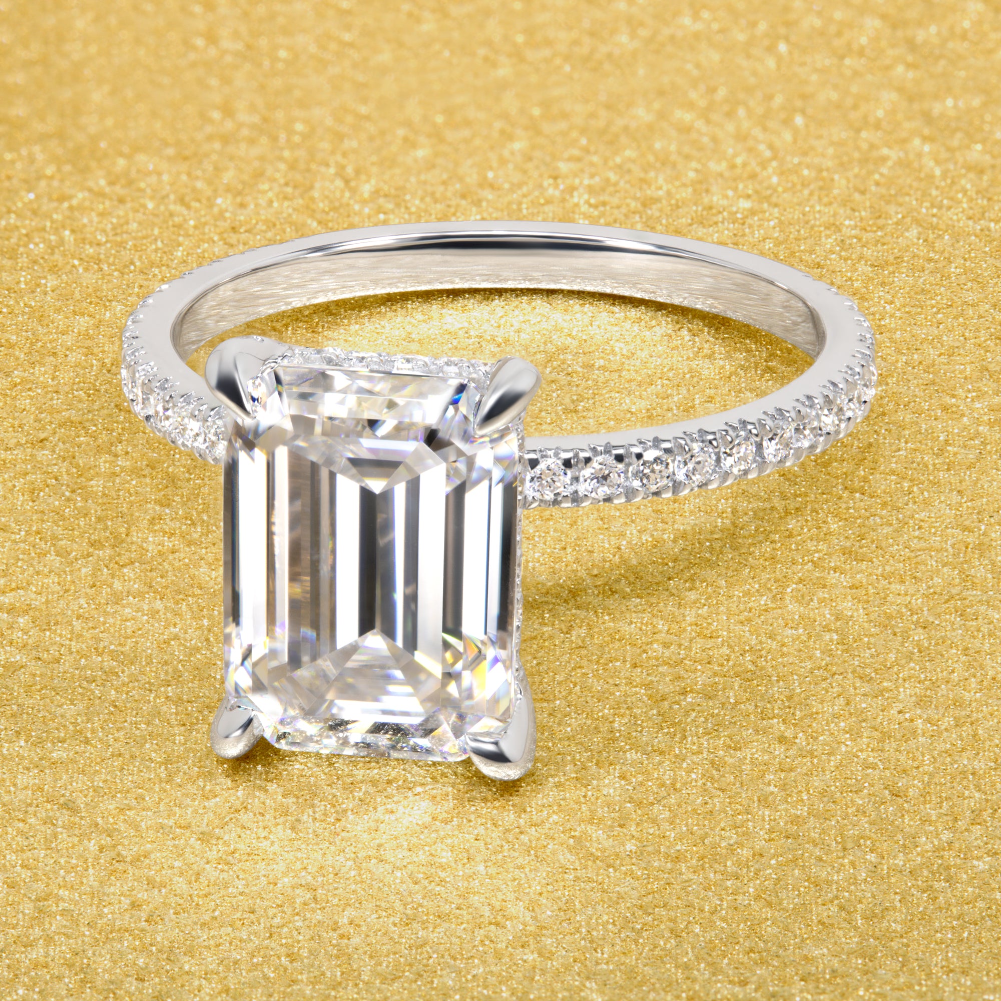 Classic Stella 3.5ct Elongated Emerald-cut Moissanite Hidden Wrap Halo and Lab-grown Diamond Engagement ring in 14K or 18K Gold handcrafted in Los Angles by Earthena Jewelry.
