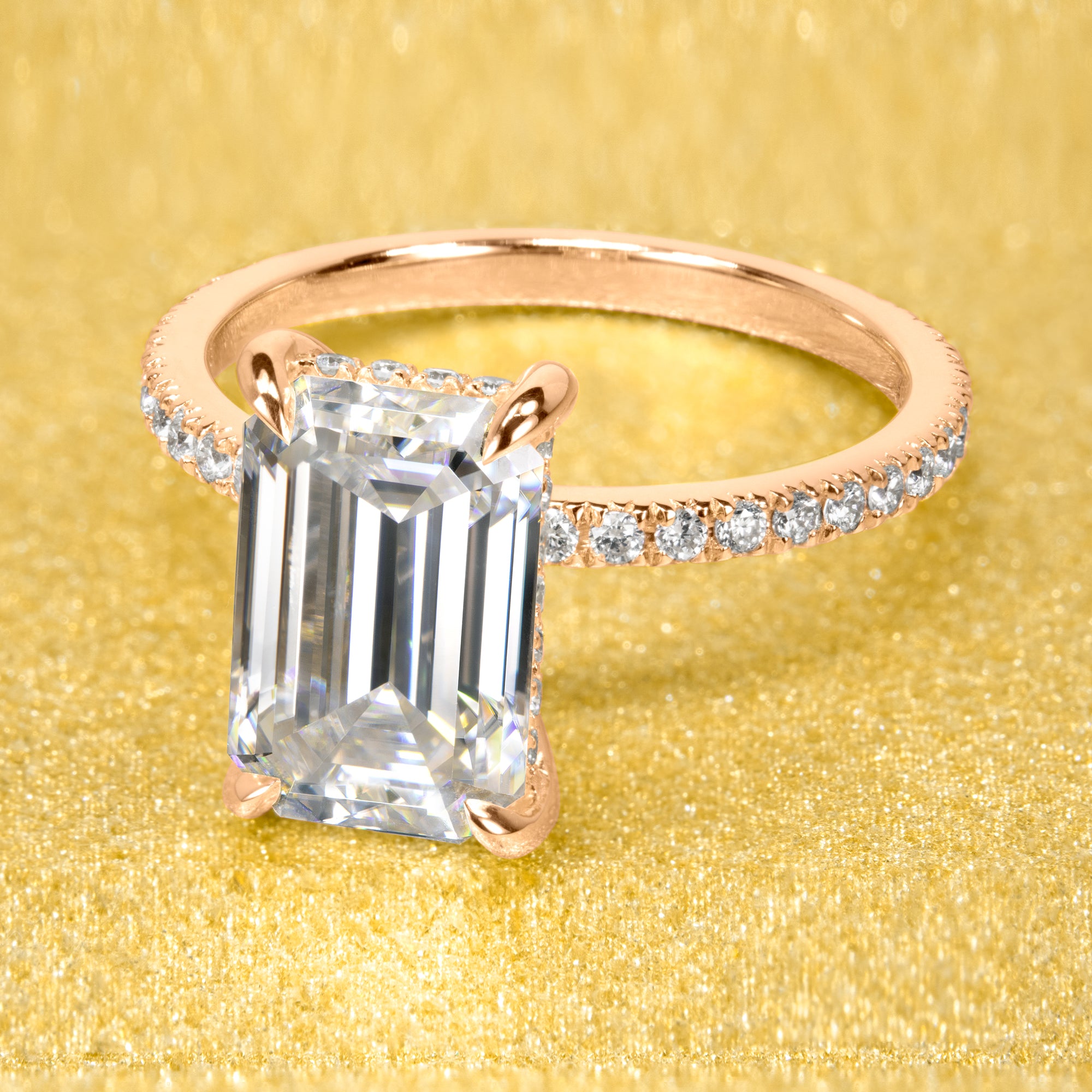 The Stella 3ct elongated emerald-cut moissanite stone with lab-grown diamond accents set in 14K gold, 18K gold, or Platinum handcrafted in Los Angeles by Earthena Jewelry