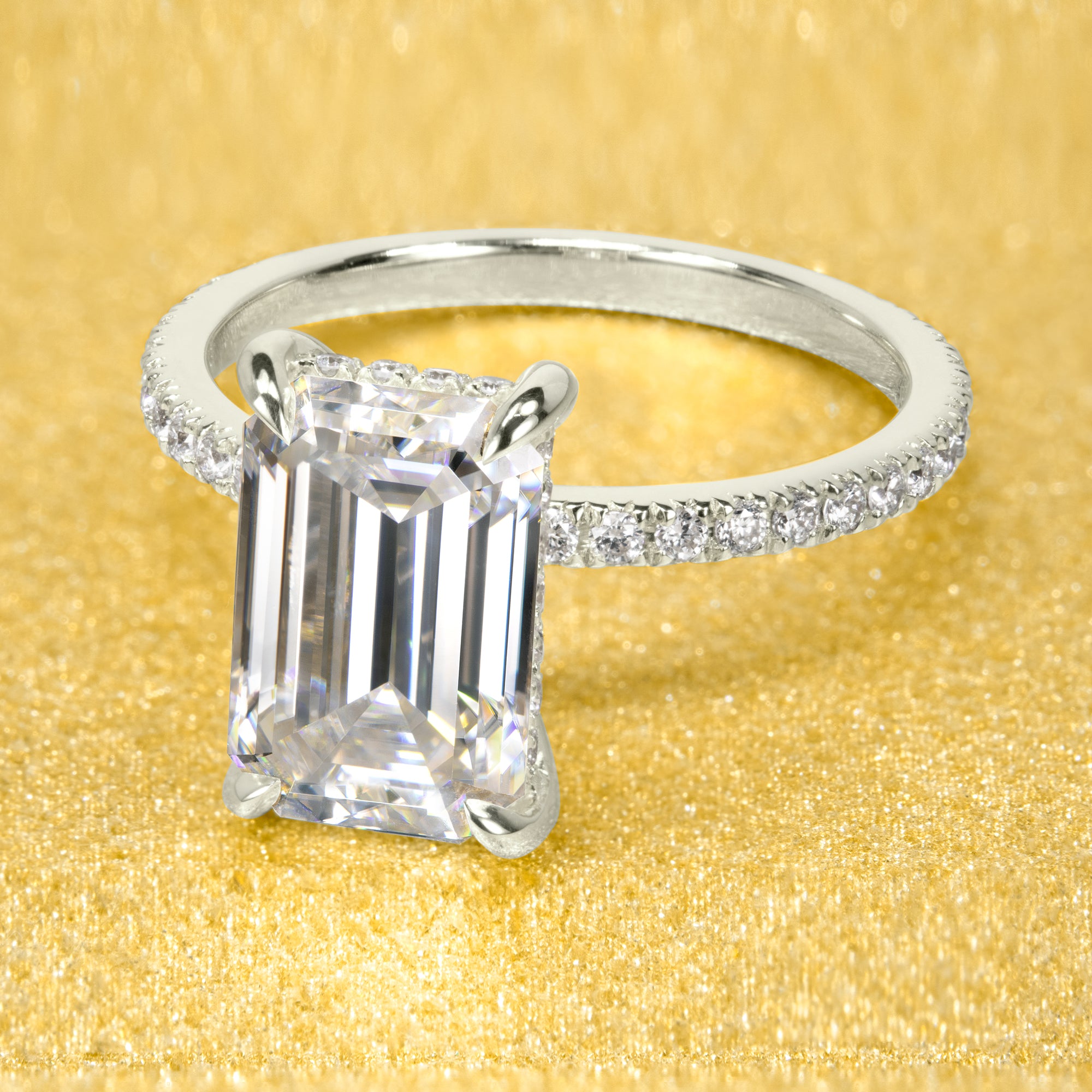 The Stella 3ct elongated emerald-cut moissanite stone with lab-grown diamond accents set in 14K gold, 18K gold, or Platinum handcrafted in Los Angeles by Earthena Jewelry