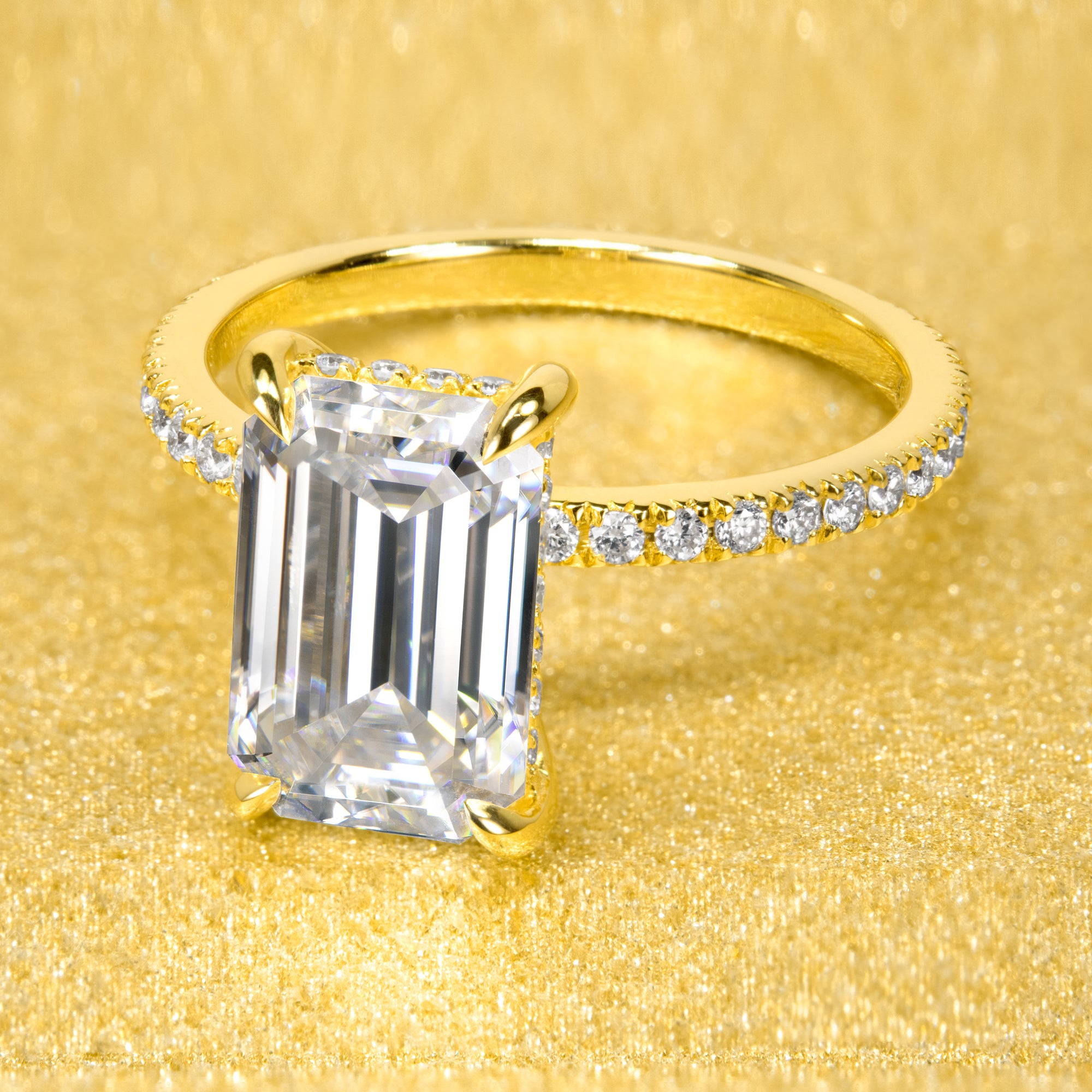 The Stella 3ct elongated emerald-cut moissanite stone with lab-grown diamond accents set in 14K gold, 18K gold, or Platinum handcrafted in Los Angeles by Earthena Jewelry