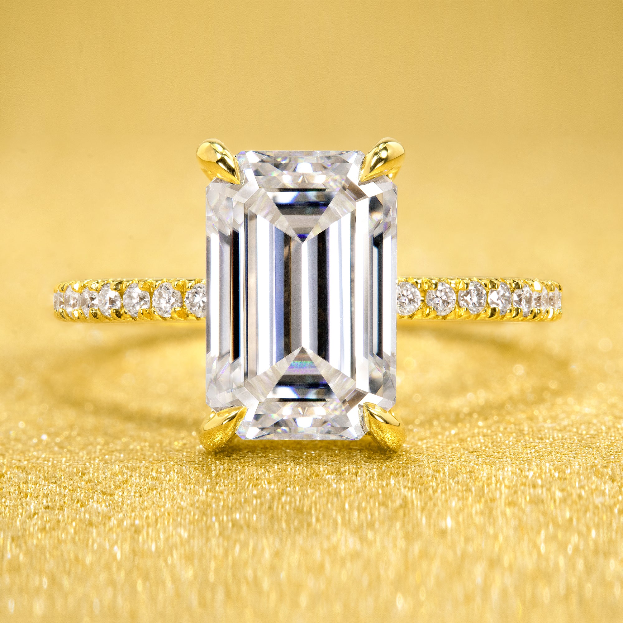The Stella 3ct elongated emerald-cut moissanite stone with lab-grown diamond accents set in 14K gold, 18K gold, or Platinum handcrafted in Los Angeles by Earthena Jewelry