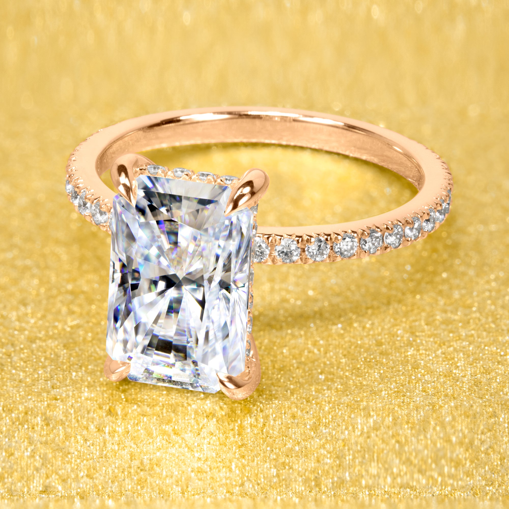 The Stella Ring beautifully combines a timeless design with handcrafted moissanite stone and lab-grown diamond accents set in 14K gold, 18K gold, or Platinum handcrafted in Los Angeles by Earthena Jewelry.