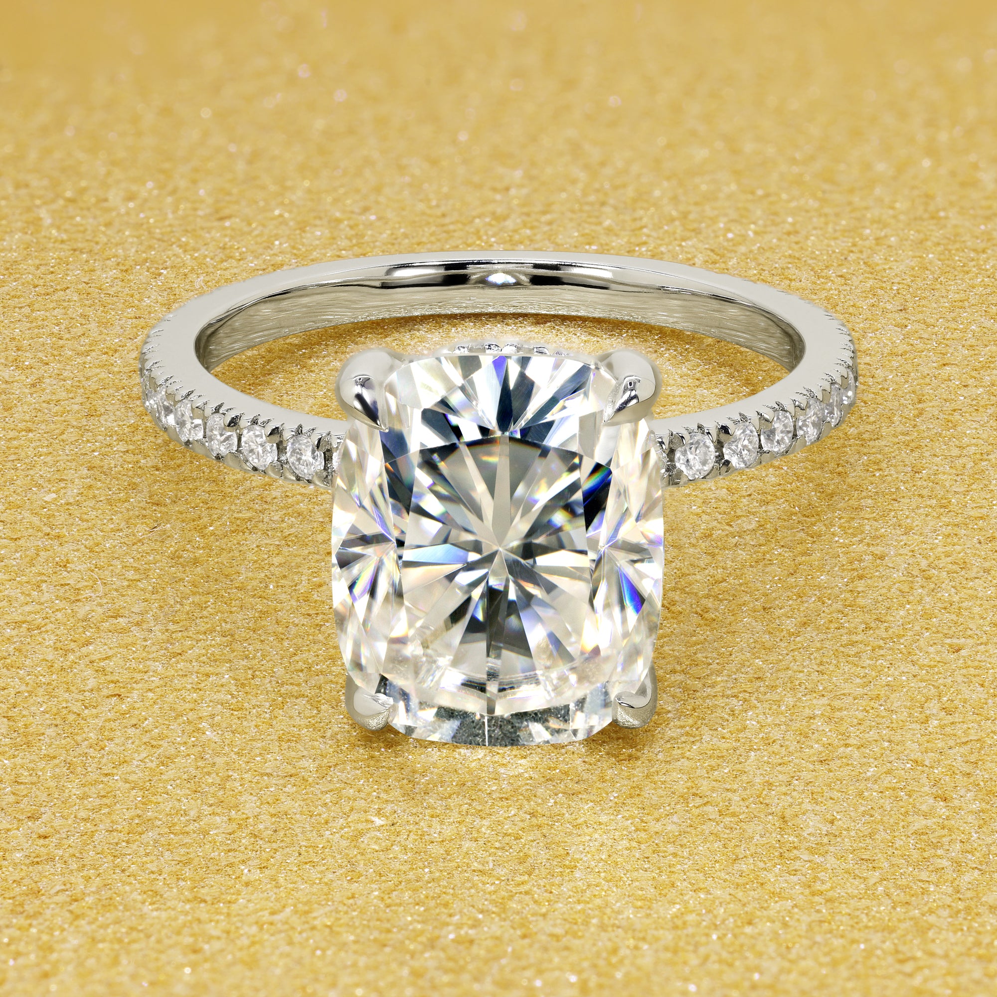 The Stella Elongated Brilliant-cut Cushion-cut Pave band Hidden Halo Moissanite Engagement Ring is a classic look with an elegant twist complemented by Moissanite stones handcrafted in 14K Gold, 18K Gold, or Platinum handcrafted in Los Angeles by Earthena Jewelry.