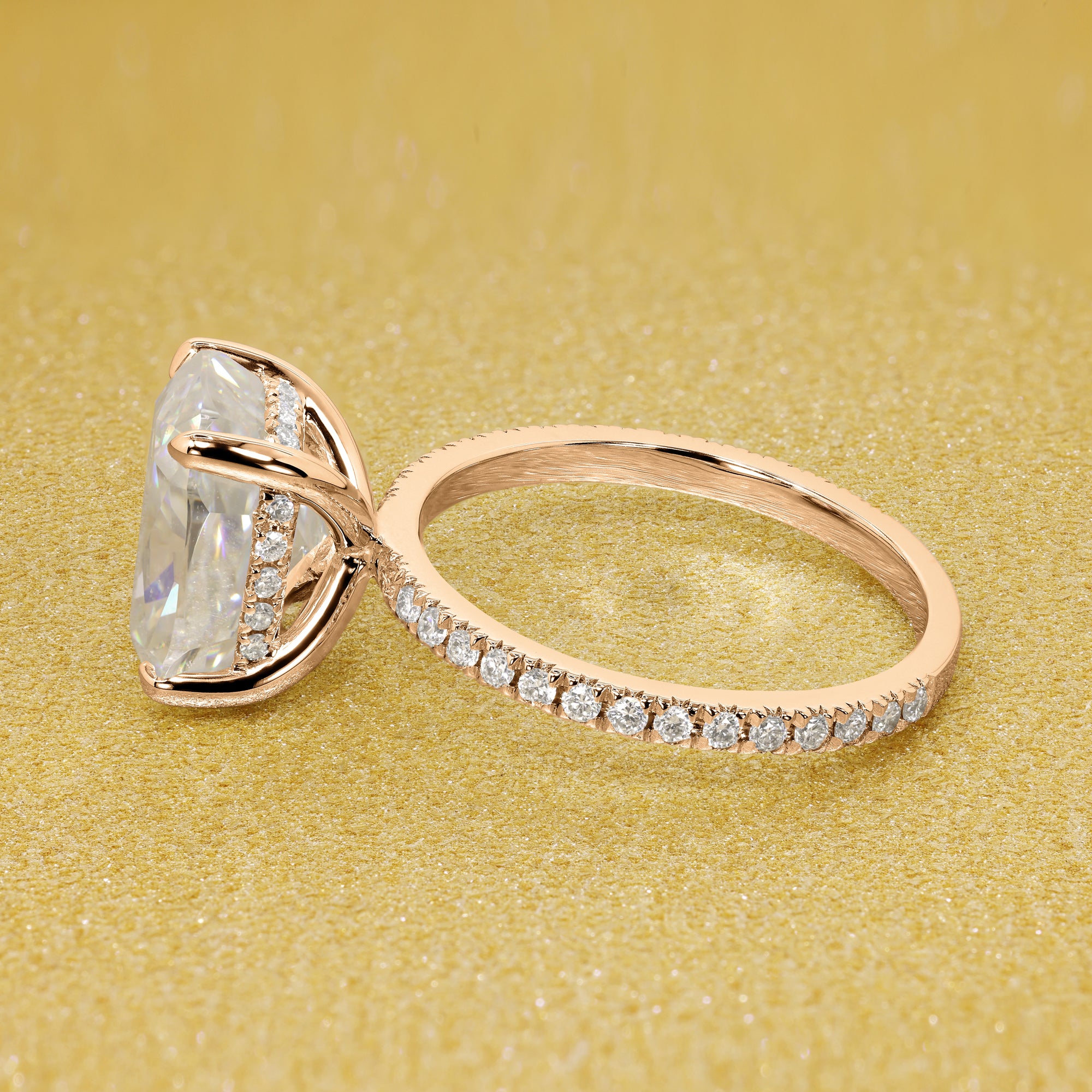 The Stella Elongated Brilliant-cut Cushion-cut Pave band Hidden Halo Moissanite Engagement Ring is a classic look with an elegant twist complemented by Moissanite stones handcrafted in 14K Gold, 18K Gold, or Platinum handcrafted in Los Angeles by Earthena Jewelry.