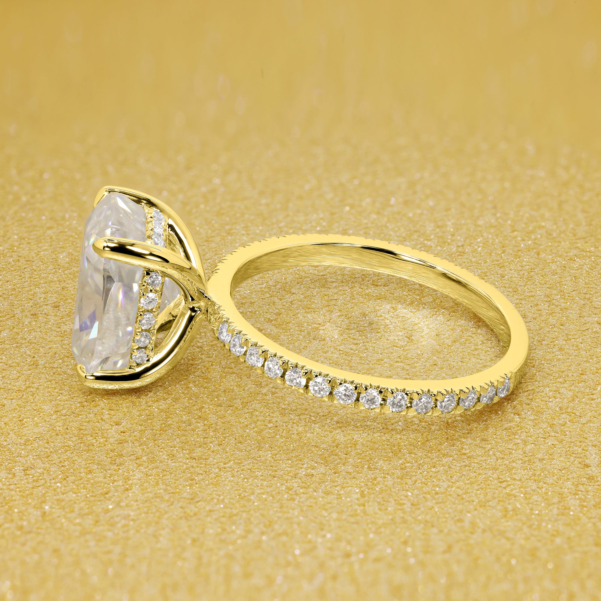 The Stella Elongated Brilliant-cut Cushion-cut Pave band Hidden Halo Moissanite Engagement Ring is a classic look with an elegant twist complemented by Moissanite stones handcrafted in 14K Gold, 18K Gold, or Platinum handcrafted in Los Angeles by Earthena Jewelry.