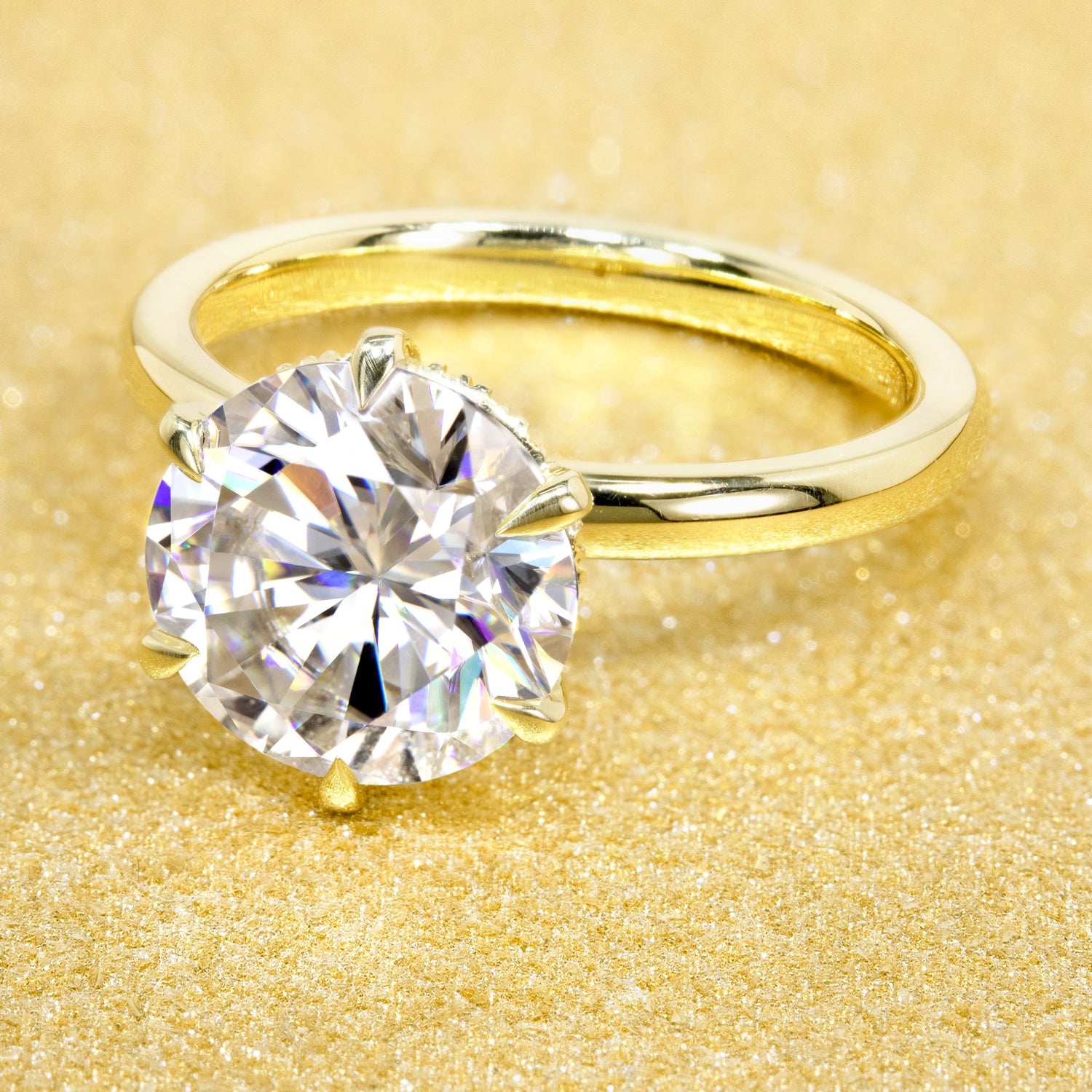 The Adara 3ct Round Brilliant-cut Moissanite Hidden Eternity Halo Engagement Ring is a classic solitaire look with an elegant twist complemented by Lab Diamonds handcrafted in 14K Gold, 18K Gold, or Platinum by Earthena Jewelry of Beverly Hills.