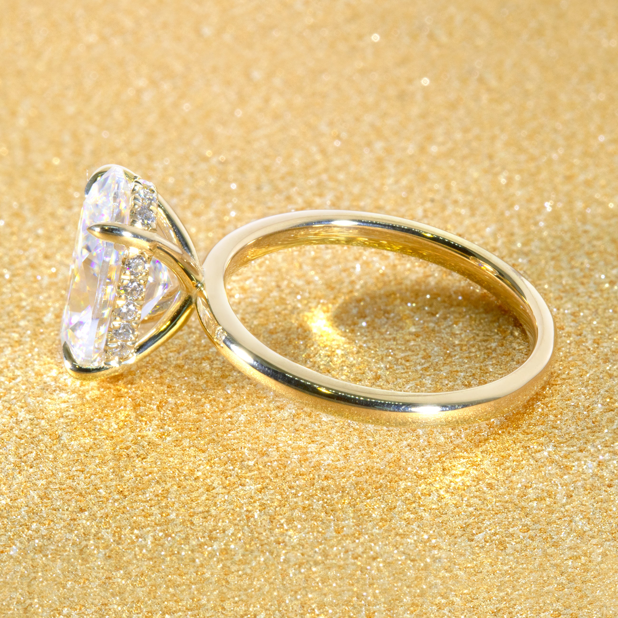 The Adara Elongated Oval-cut Moissanite Hidden Halo Engagement Ring is a classic look with an elegant twist complemented by Lab Diamonds handcrafted in 14K, Gold, 18K Gold, or Platinum by Earthena Jewelry of Beverly Hills.