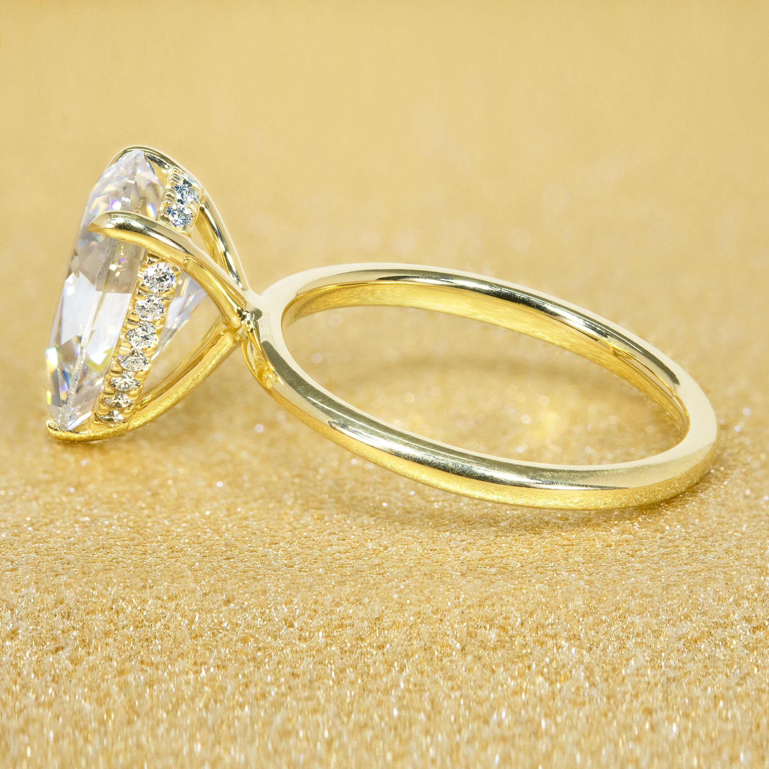 The Adara 3.5ct Pear-shaped Moissanite Hidden Halo Engagement Ring is a classic look with an elegant twist complemented by Lab Diamonds handcrafted in 14K Gold, 18K Gold, or Platinum by Earthena Jewelry of Beverly HIlls