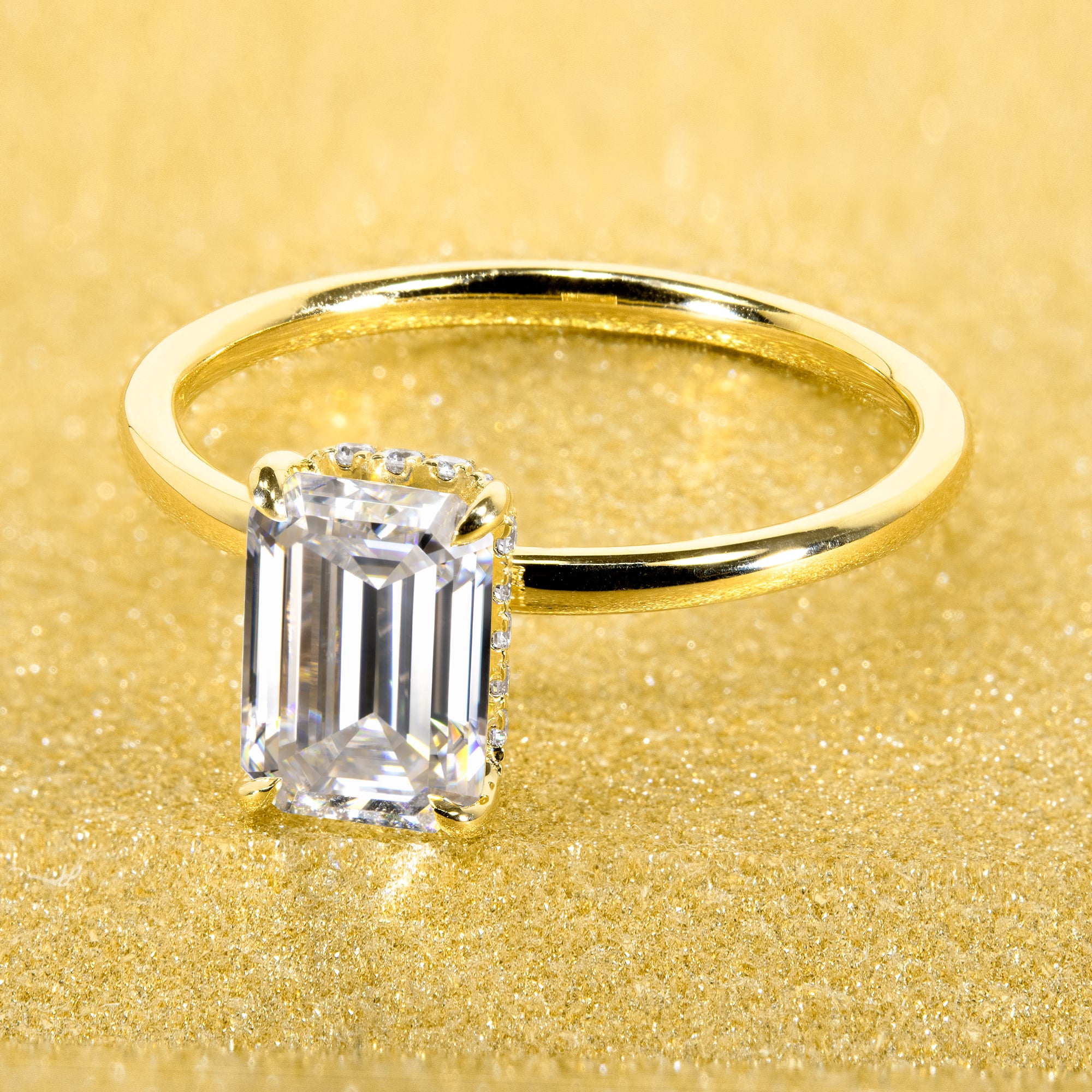 Classic and Minimalistic Ariela 1.5ct Elongated Emerald-cut Moissante Halo Solitaire Engagement ring complemented by Lab Diamonds handcrafted in 14K Gold, 18K Gold, or Platinum by Earthena Jewelry of Beverly Hills.