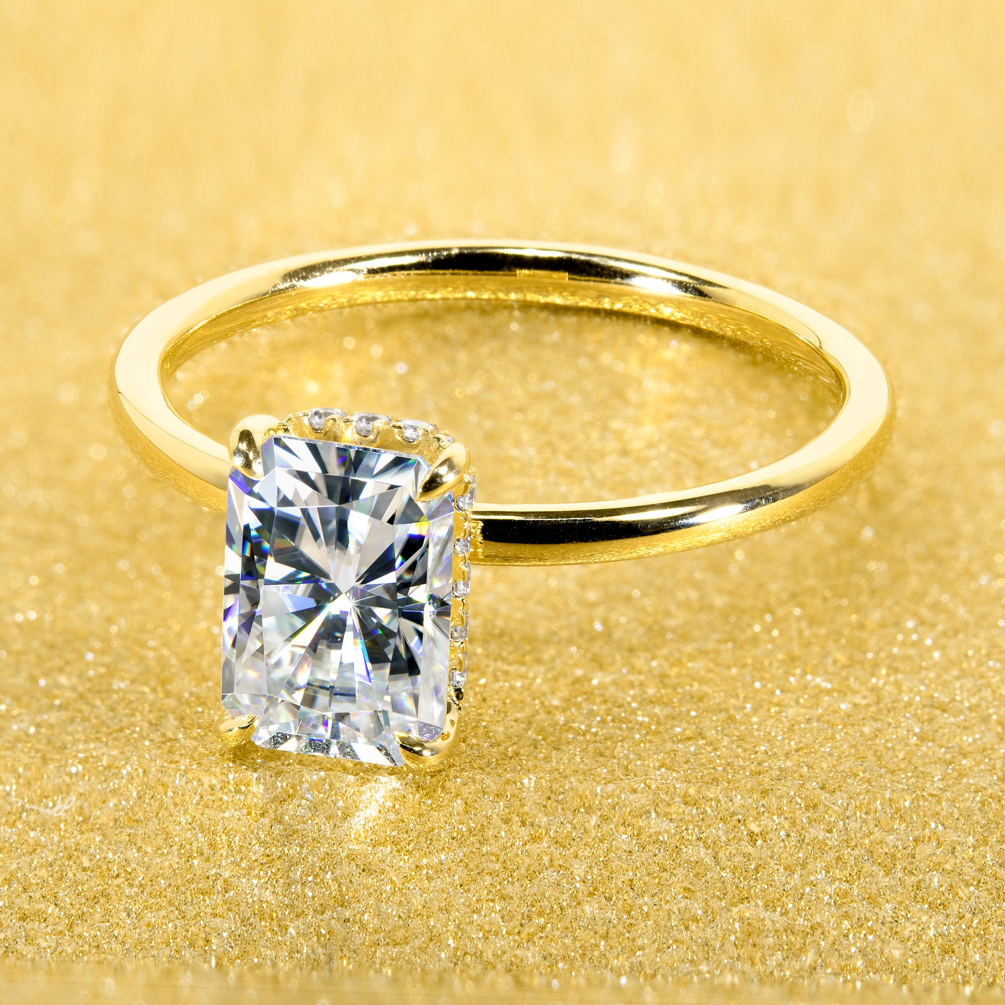 Classic and Minimalistic Ariela 1.5ct Elongated Radiant-cut Moissanite Halo Solitaire Engagement ring complemented by Lab Diamonds handcrafted in 14K Gold, 18K Gold, or Platinum by Earthena Jewelry of Beverly Hills.