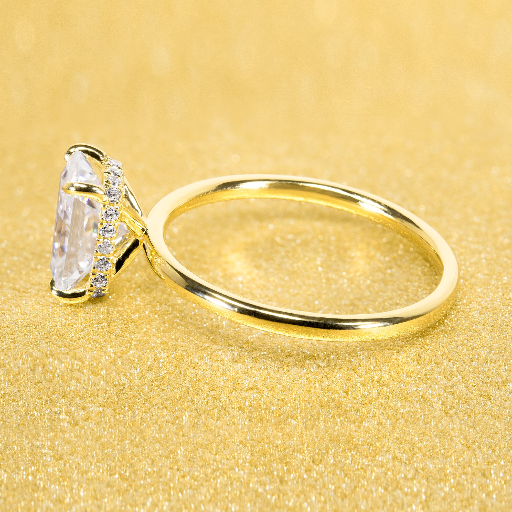 Classic and Minimalistic Ariela 1.5ct Elongated Radiant-cut Moissanite Halo Solitaire Engagement ring complemented by Lab Diamonds handcrafted in 14K Gold, 18K Gold, or Platinum by Earthena Jewelry of Beverly Hills.