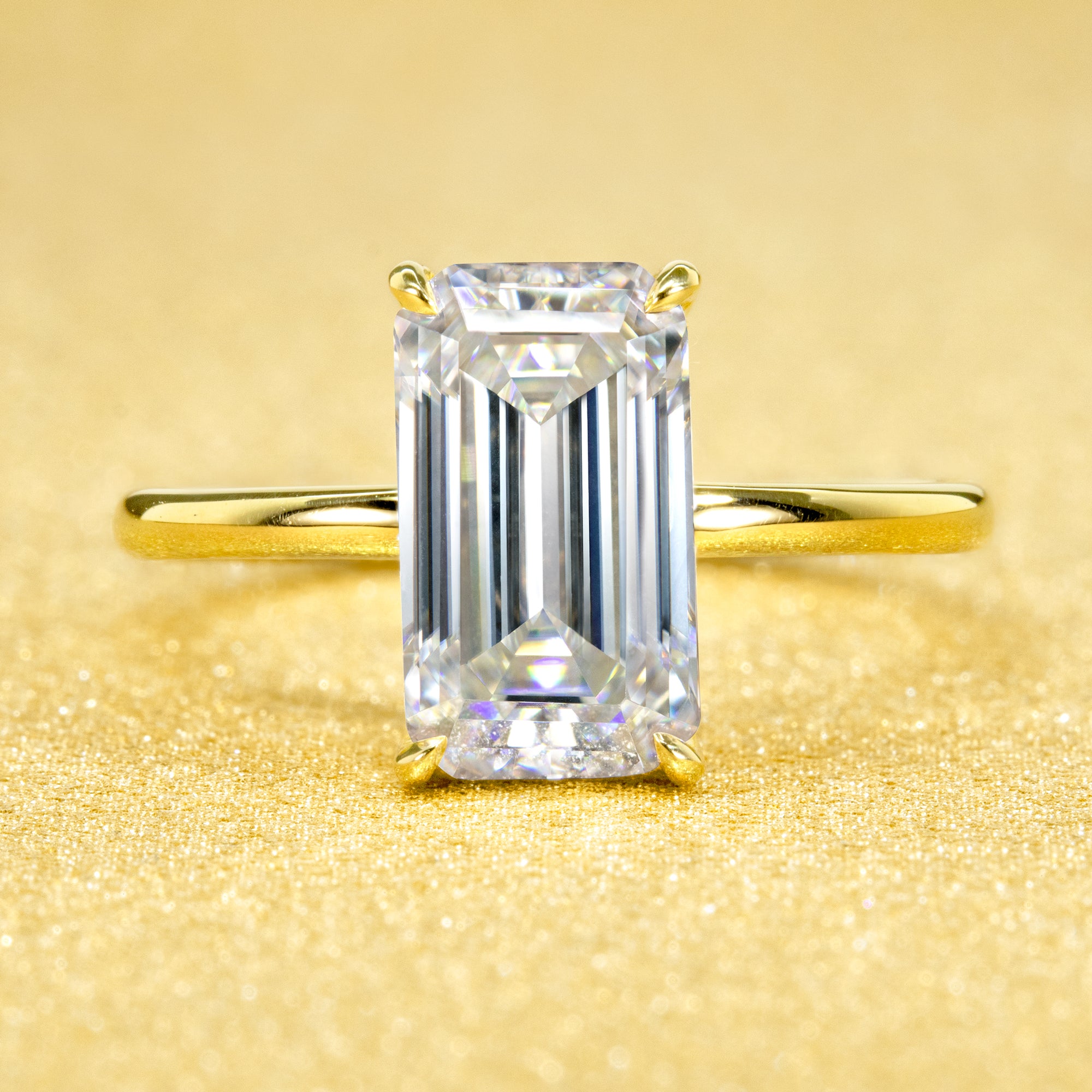 Classic Ariela 3ct Elongated Emerald-cut Moissanite Halo Solitaire Engagement ring complemented by Lab Diamonds handcrafted in 14K Gold, 18K Gold, or Platinum by Earthena Jewelry of Beverly Hills.