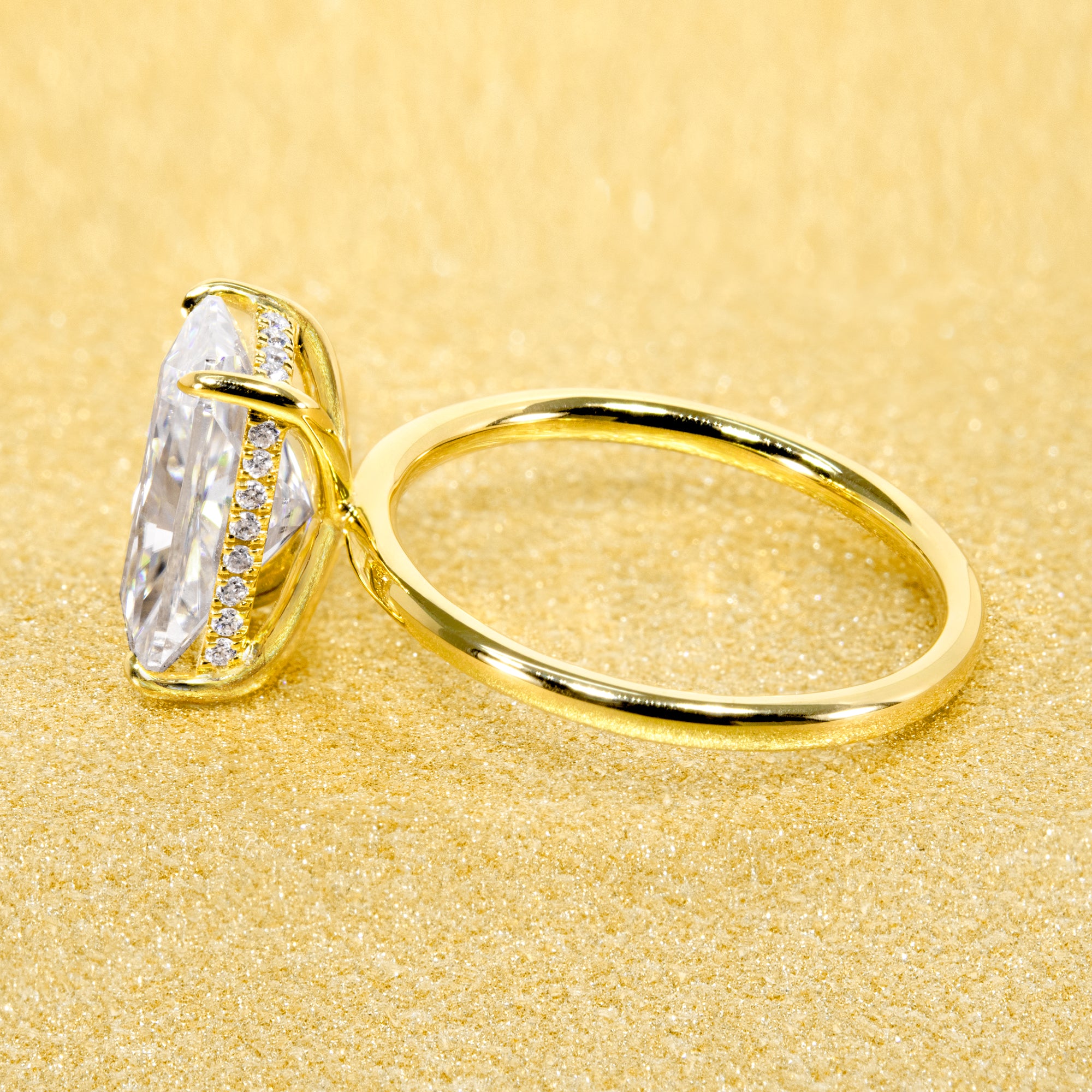 Classic Ariela 3ct Elongated Radiant-cut Moissanite Halo Solitaire Engagement ring complemented by Lab Diamonds handcrafted in 14K Gold, 18K Gold, or Platinum by Earthena Jewelry of Beverly Hills.