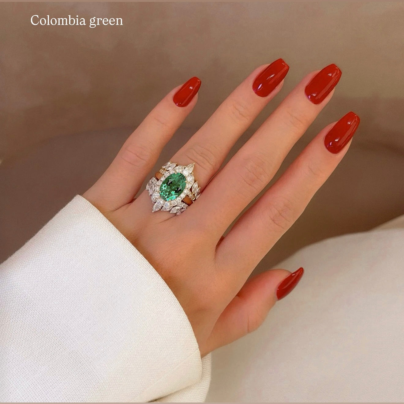 Gloria 3ct Oval Lab-Grown Colombian Green Emerald Trio Set with Dual Isabella V-Shaped Diamond Bands in 14K Gold, 18K Gold, or Platinum by Earthena Jewelry of Beverly Hills.