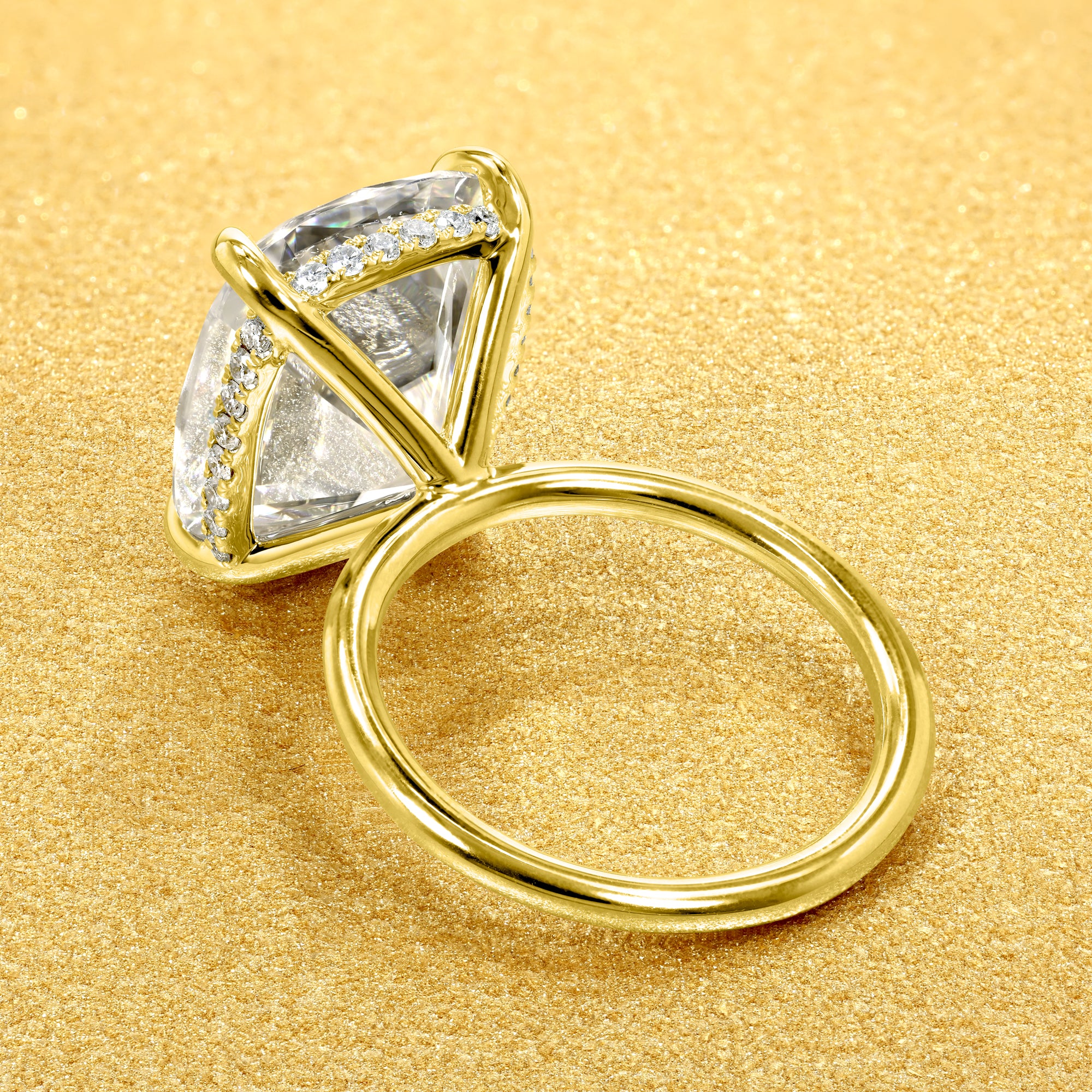 The Adara Elongated Old Mine Cushion-cut Hidden Halo Moissanite Engagement Ring, a classic look with an elegant twist complemented by Lab Diamonds handcrafted in 14K gold, 18K gold, or Platinum by Earthena Jewelry of Beverly Hills.