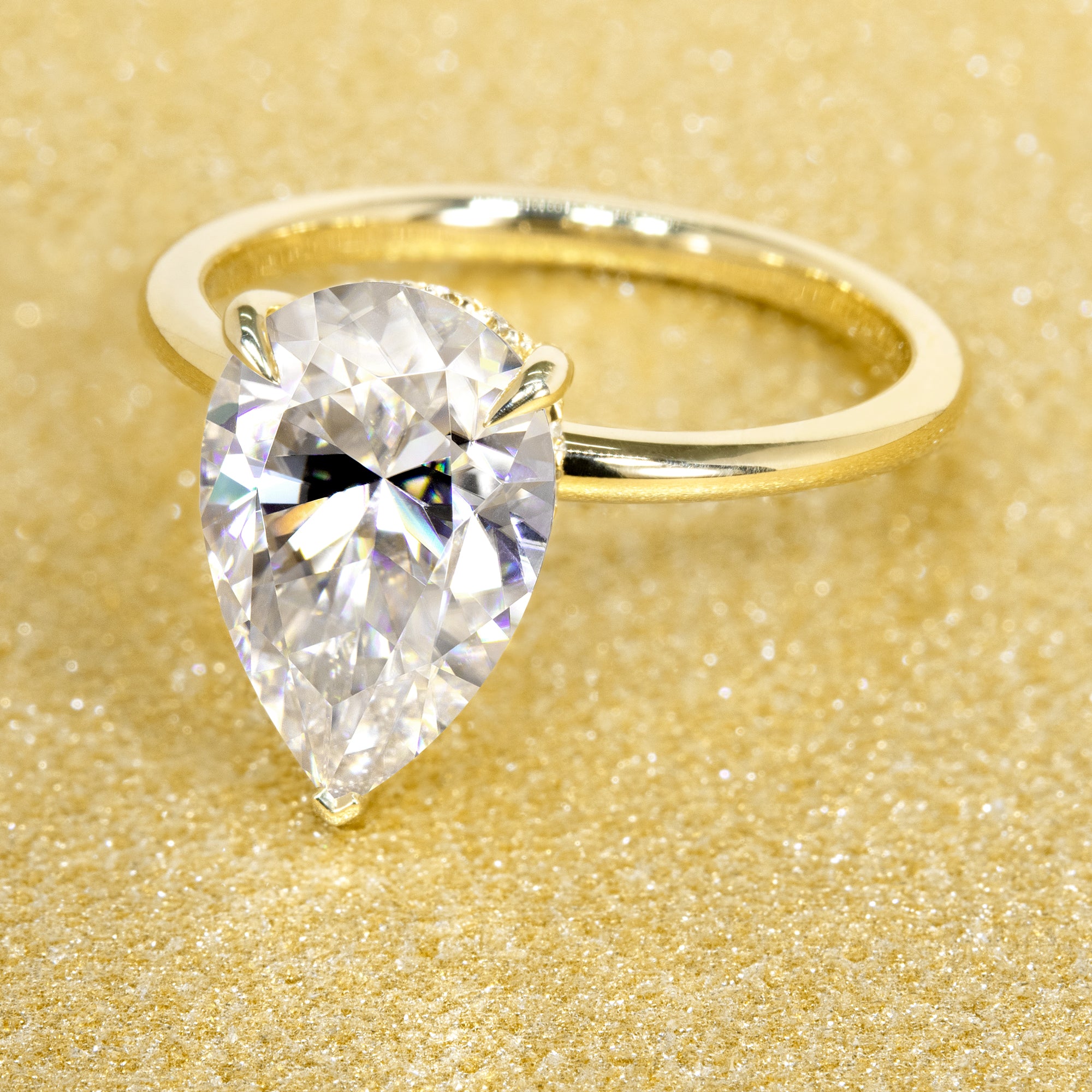 The Adara, 3ct Elongated Pear-Cut Lab-Grown Diamond Hidden Halo Engagement Ring in 14K Gold, 18K Gold, or Platinum by Earthena Jewelry of Beverly Hills.