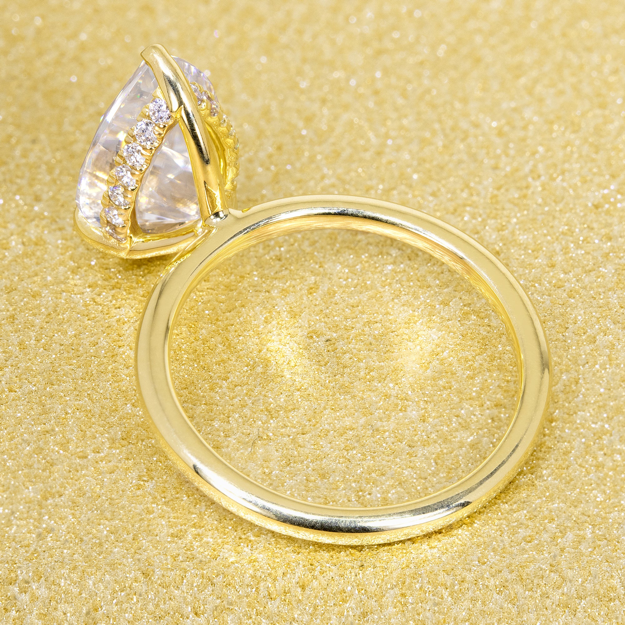 The Adara, 3ct Elongated Pear-Cut Lab-Grown Diamond Hidden Halo Engagement Ring in 14K Gold, 18K Gold, or Platinum by Earthena Jewelry of Beverly Hills.