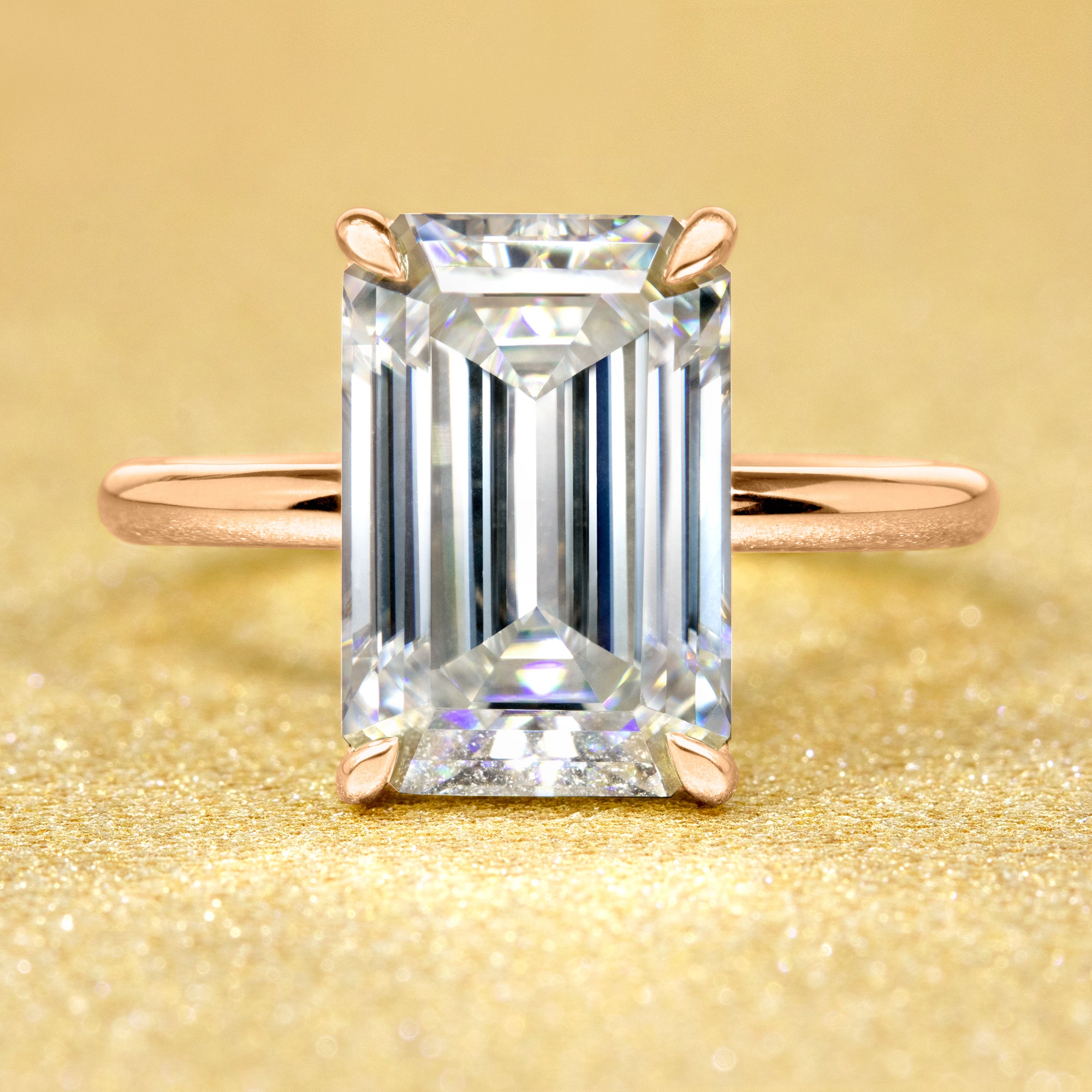 The Adara, 5ct Elongated Emerald-Cut Lab-Grown Diamond Hidden Halo Engagement Ring in 14K Gold, 18K Gold, or Platinum by Earthena Jewelry of Beverly Hills.