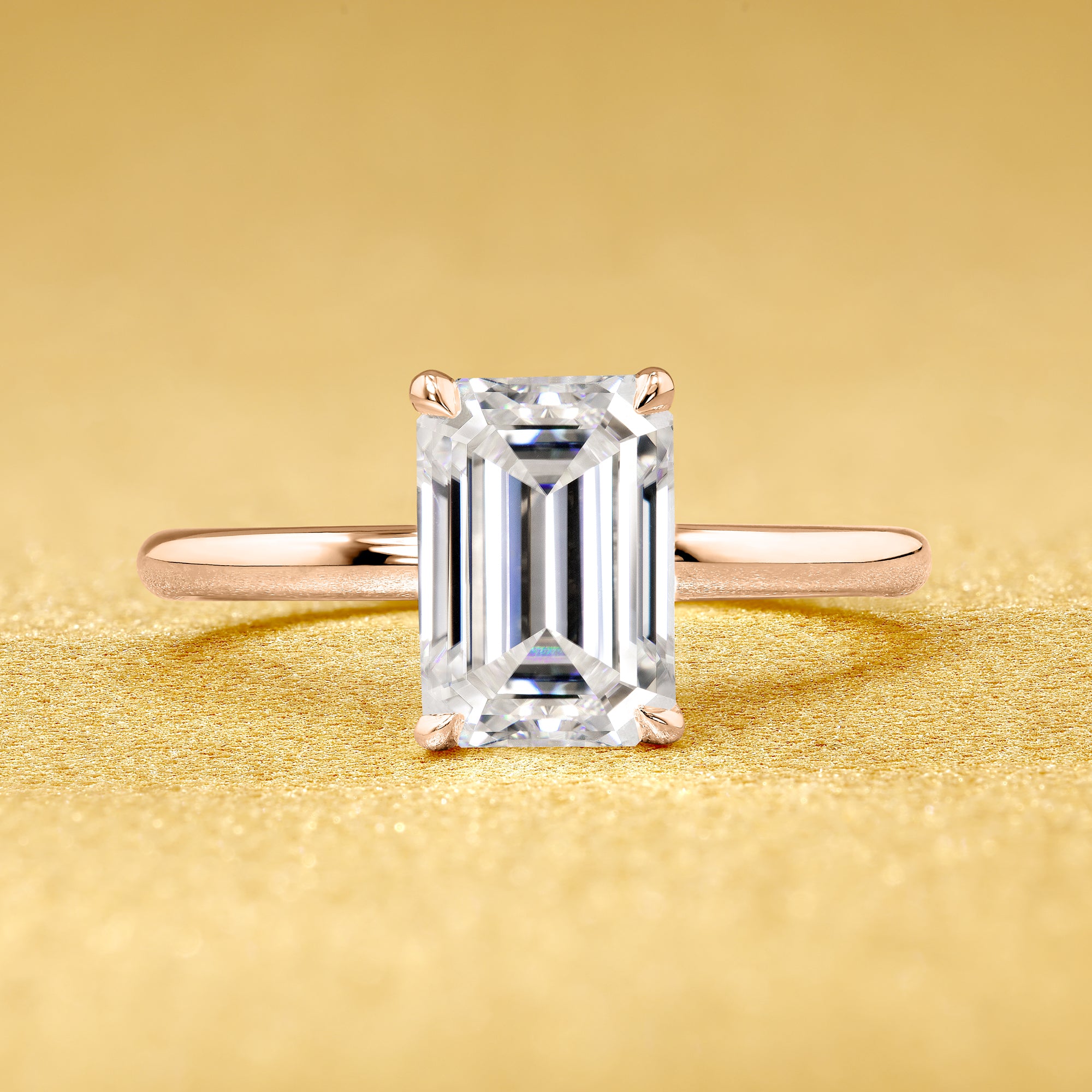 The Adara, 2ct Elongated Emerald-Cut Lab-Grown Diamond Hidden Halo Engagement Ring in 14K Gold, 18K Gold, or Platinum by Earthena Jewelry of Beverly Hills.