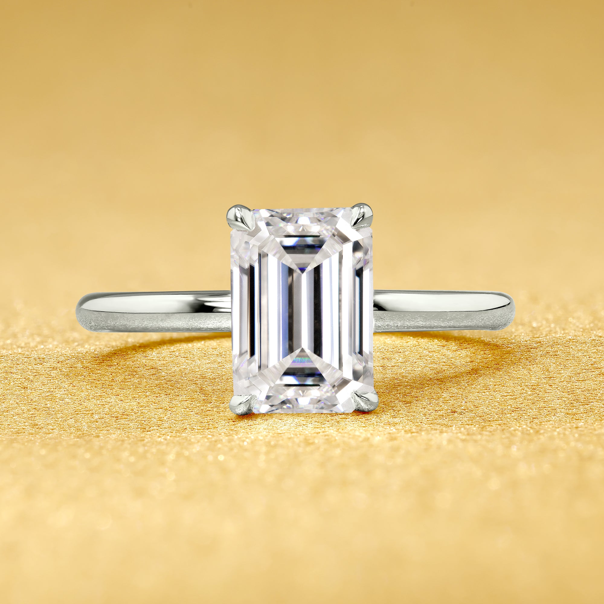 The Adara, 2ct Elongated Emerald-Cut Lab-Grown Diamond Hidden Halo Engagement Ring in 14K Gold, 18K Gold, or Platinum by Earthena Jewelry of Beverly Hills.