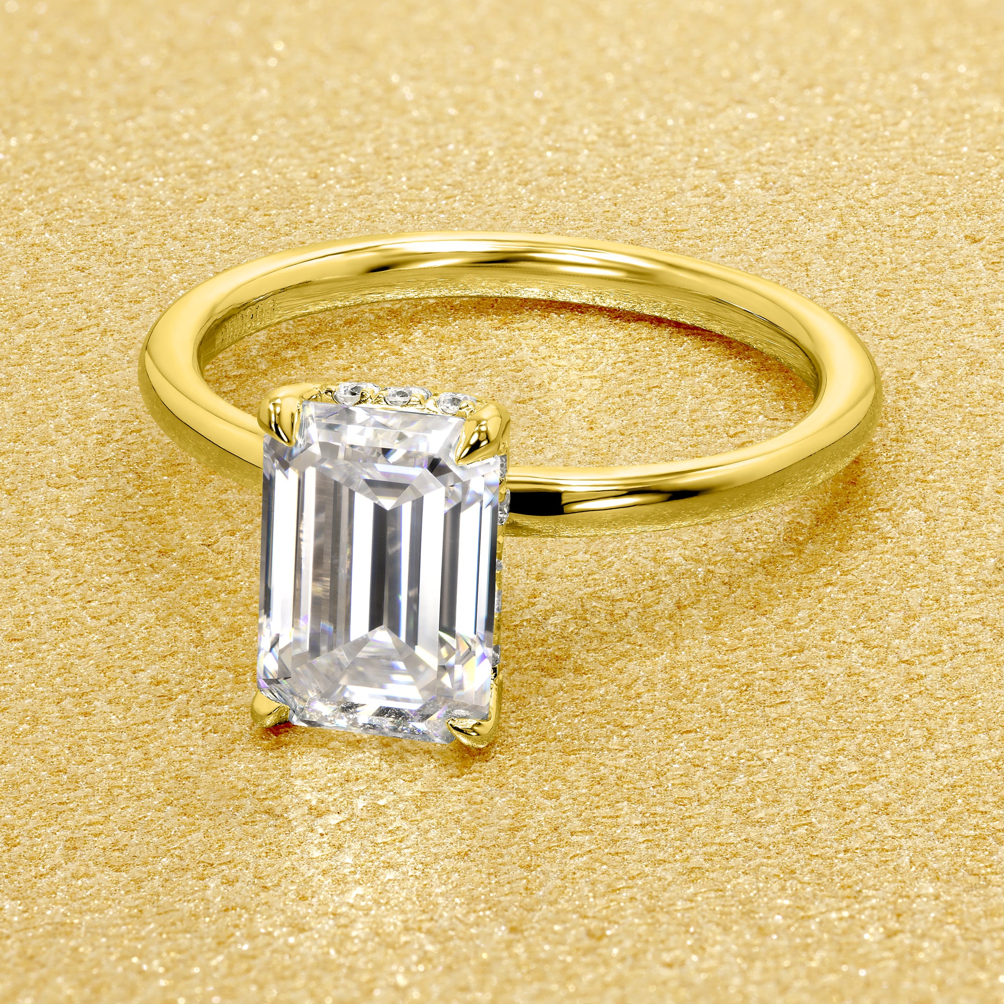 The Adara, 2ct Elongated Emerald-Cut Lab-Grown Diamond Hidden Halo Engagement Ring in 14K Gold, 18K Gold, or Platinum by Earthena Jewelry of Beverly Hills.