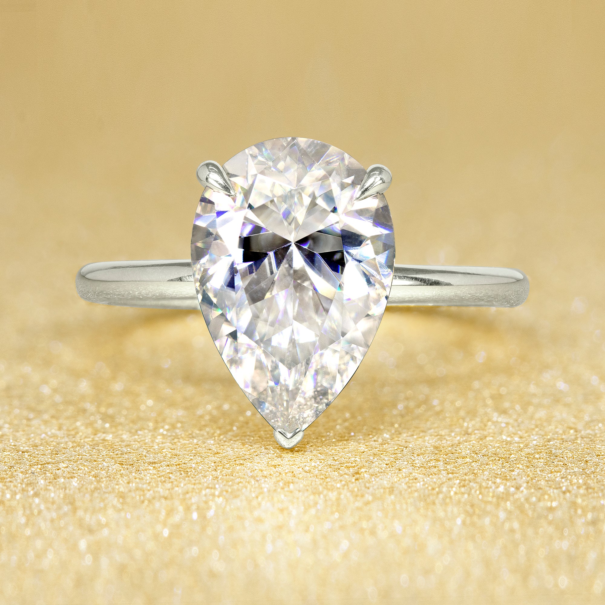 The Adara, 3ct Elongated Pear-Cut Lab-Grown Diamond Hidden Halo Engagement Ring in 14K Gold, 18K Gold, or Platinum by Earthena Jewelry of Beverly Hills.