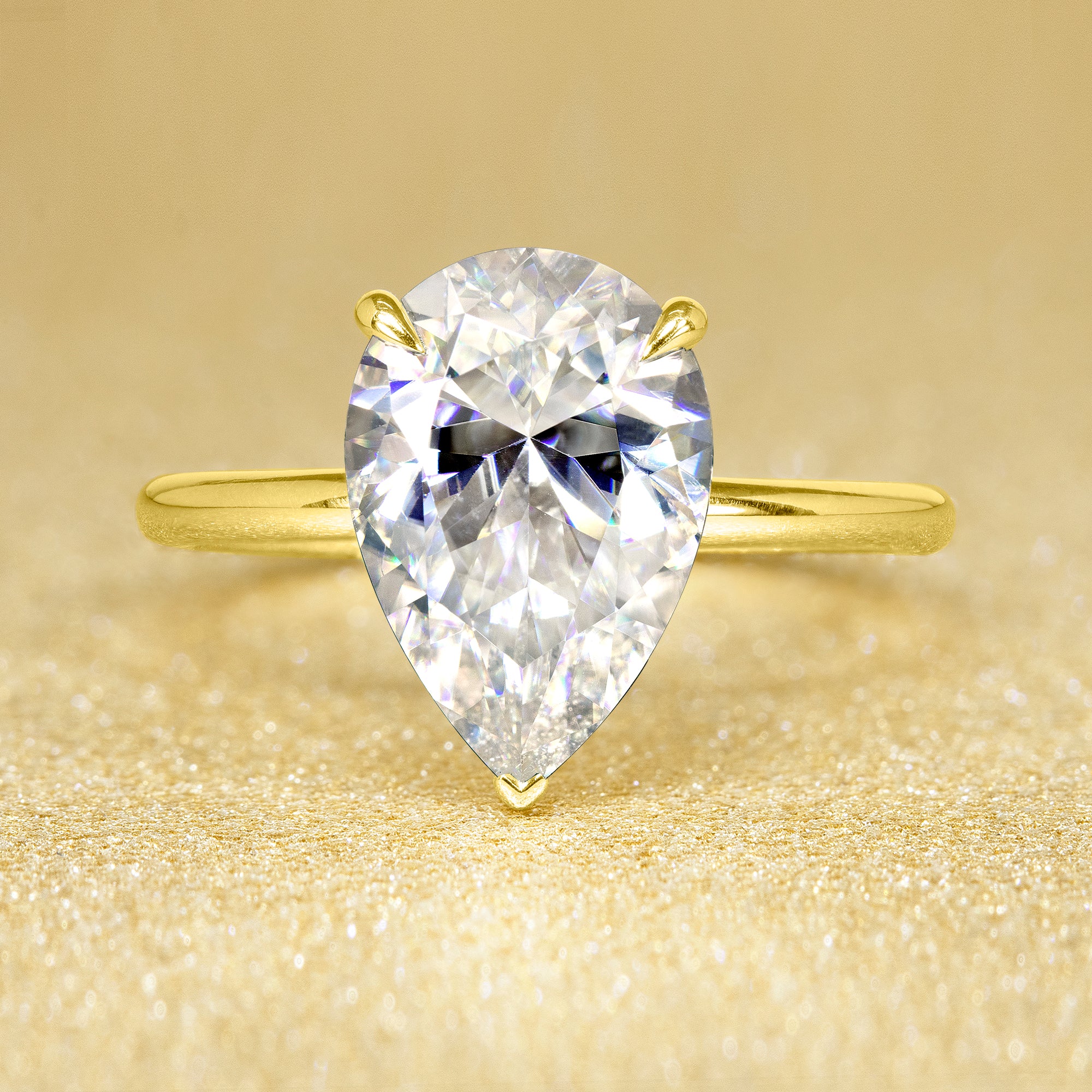 The Adara, 3ct Elongated Pear-Cut Lab-Grown Diamond Hidden Halo Engagement Ring in 14K Gold, 18K Gold, or Platinum by Earthena Jewelry of Beverly Hills.