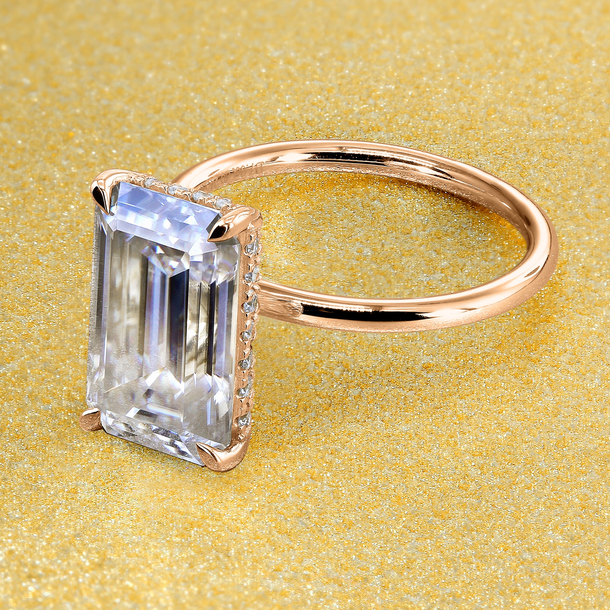 Classic Ariela 5.5ct Elongated Emerald-cut Moissanite Halo Solitaire Engagement ring complemented by Lab Diamonds handcrafted in 14K Gold, 18K Gold, or Platinum by Earthena Jewelry of Beverly Hills.