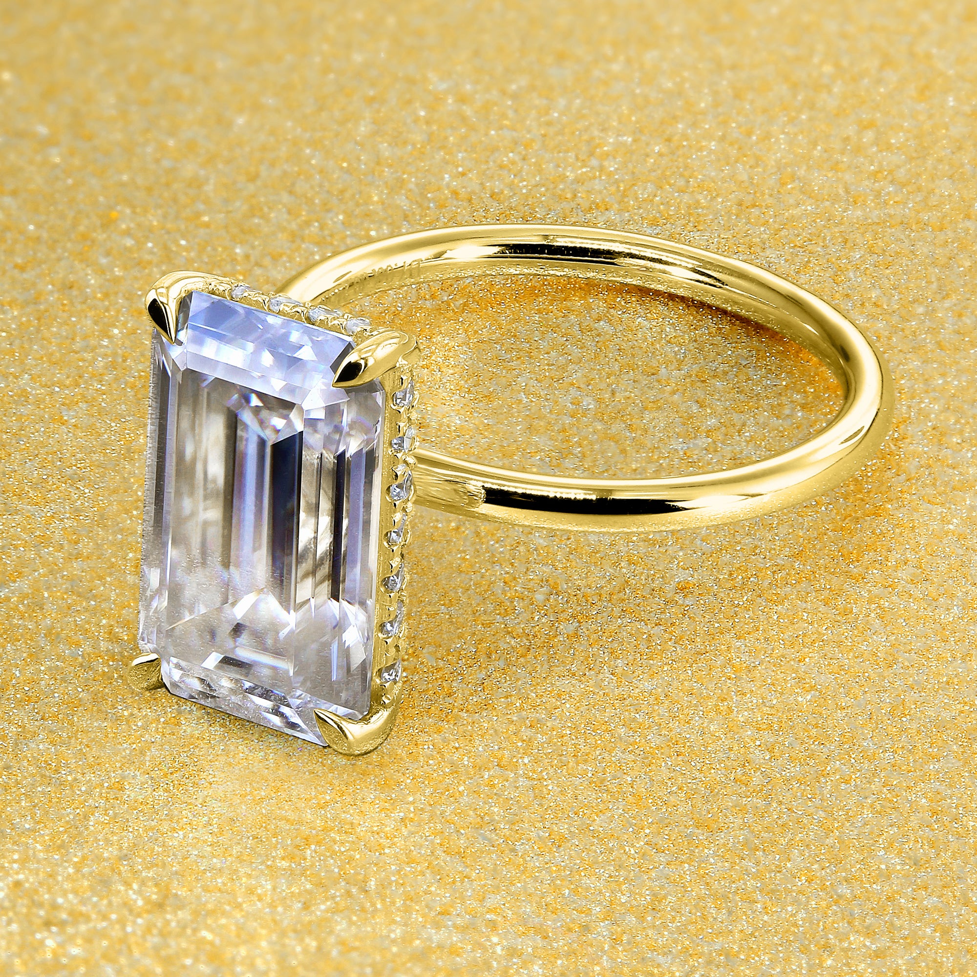 Classic Ariela 5.5ct Elongated Emerald-cut Moissanite Halo Solitaire Engagement ring complemented by Lab Diamonds handcrafted in 14K Gold, 18K Gold, or Platinum by Earthena Jewelry of Beverly Hills.