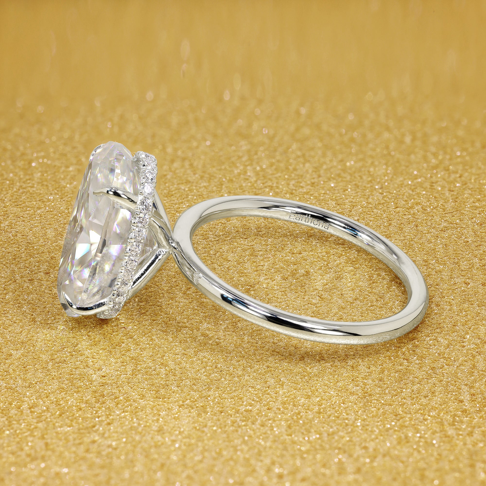 Classic Ariela 7ct Elongated Oval-cut Moissanite and Lab Diamond Hidden Halo Solitaire ring in 14K gold, 18K gold, or Platinum handcrafted in Los Angeles by Earthena Jewelry