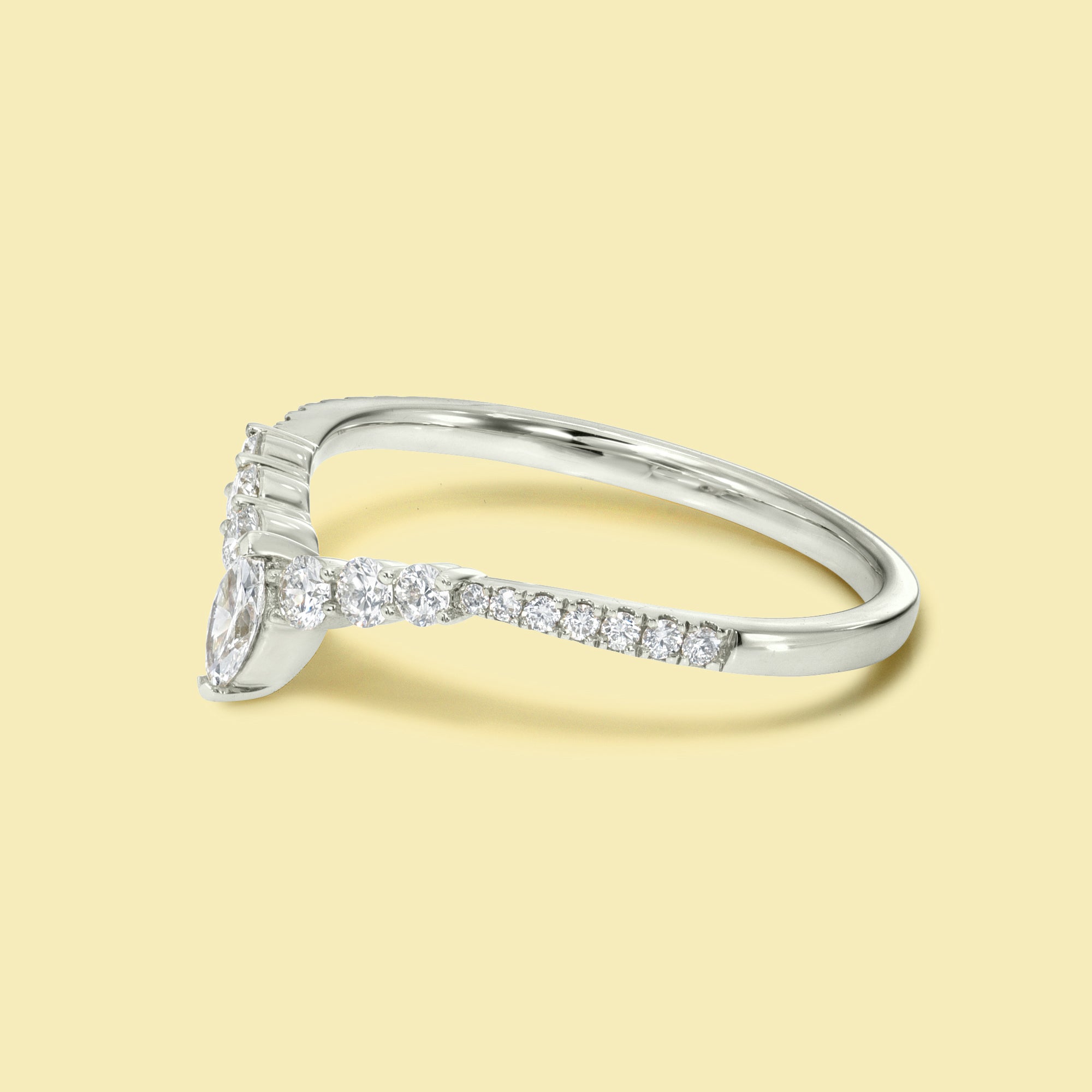 The Audrey, Curved V-shaped Diamond Band is handcrafted in 14K gold, 18K gold, or Platinum by Earthena Jewelry in Los Angeles