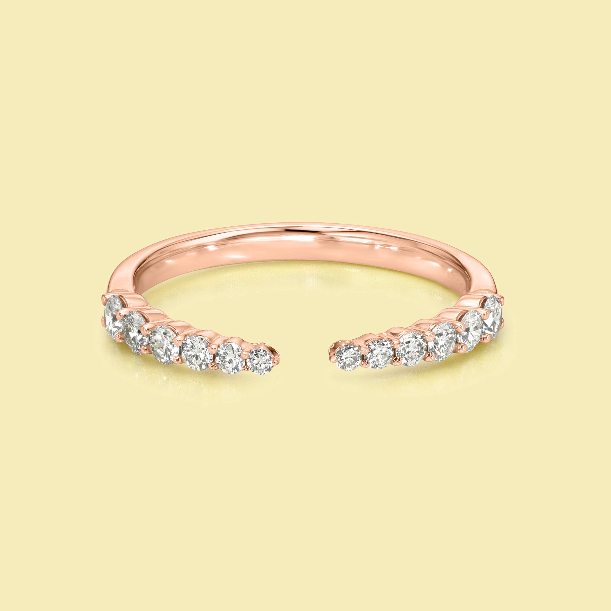 The Audrey, Graduated Open Claw Diamond Band is handcrafted in 14K gold, 18K gold, or Platinum by Earthena Jewelry in Los Angeles