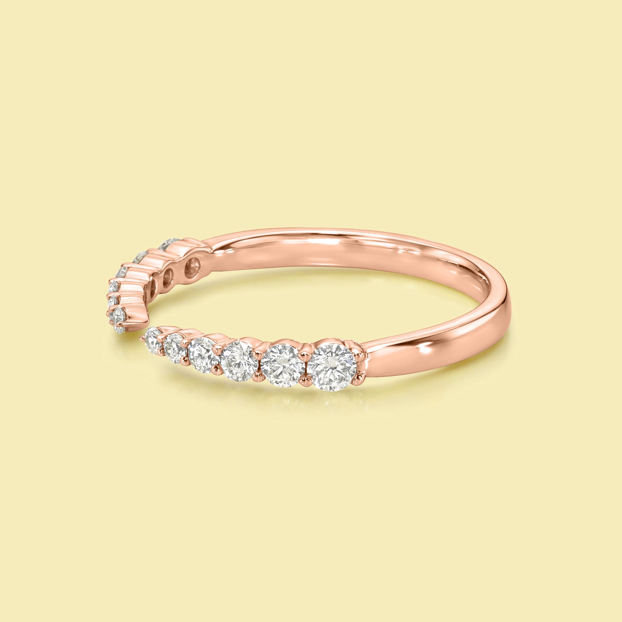 The Audrey, Graduated Open Claw Diamond Band is handcrafted in 14K gold, 18K gold, or Platinum by Earthena Jewelry in Los Angeles