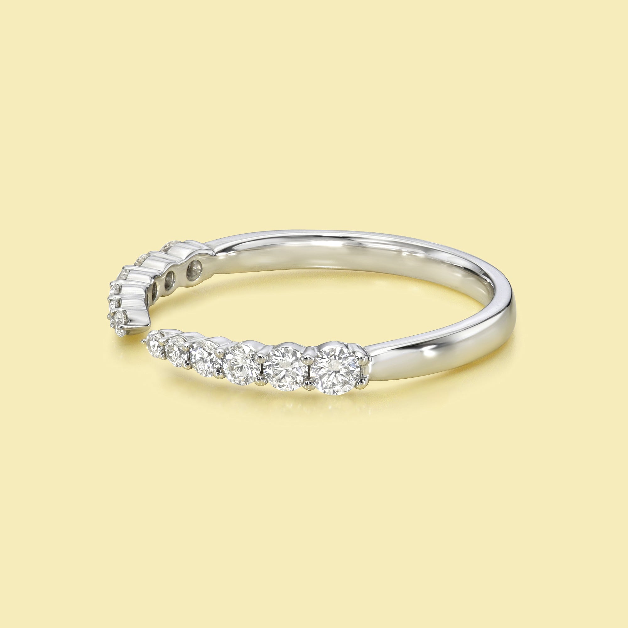 The Audrey, Graduated Open Claw Diamond Band is handcrafted in 14K gold, 18K gold, or Platinum by Earthena Jewelry in Los Angeles